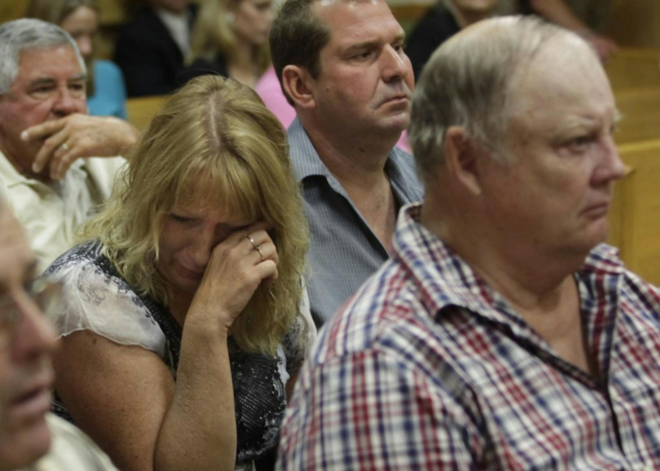 Sheila Myers' coworker Jodi Ludwig and Myers' husband Roger, right, reacted to graphic images of the murder scene at the trial.