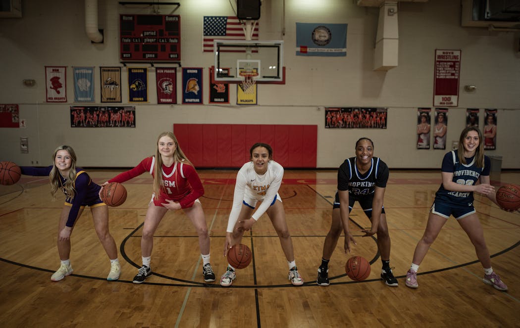 The girls basketball All-Metro first team, from left: Kennedy Sanders of Chaska, Olivia Olson of Benilde-St. Margaret, Metro Player of the Year Tessa Johnson of St. Michael-Albertville, Nunu Agara of Hopkins and Maddyn Greenway of Providence Academy.
