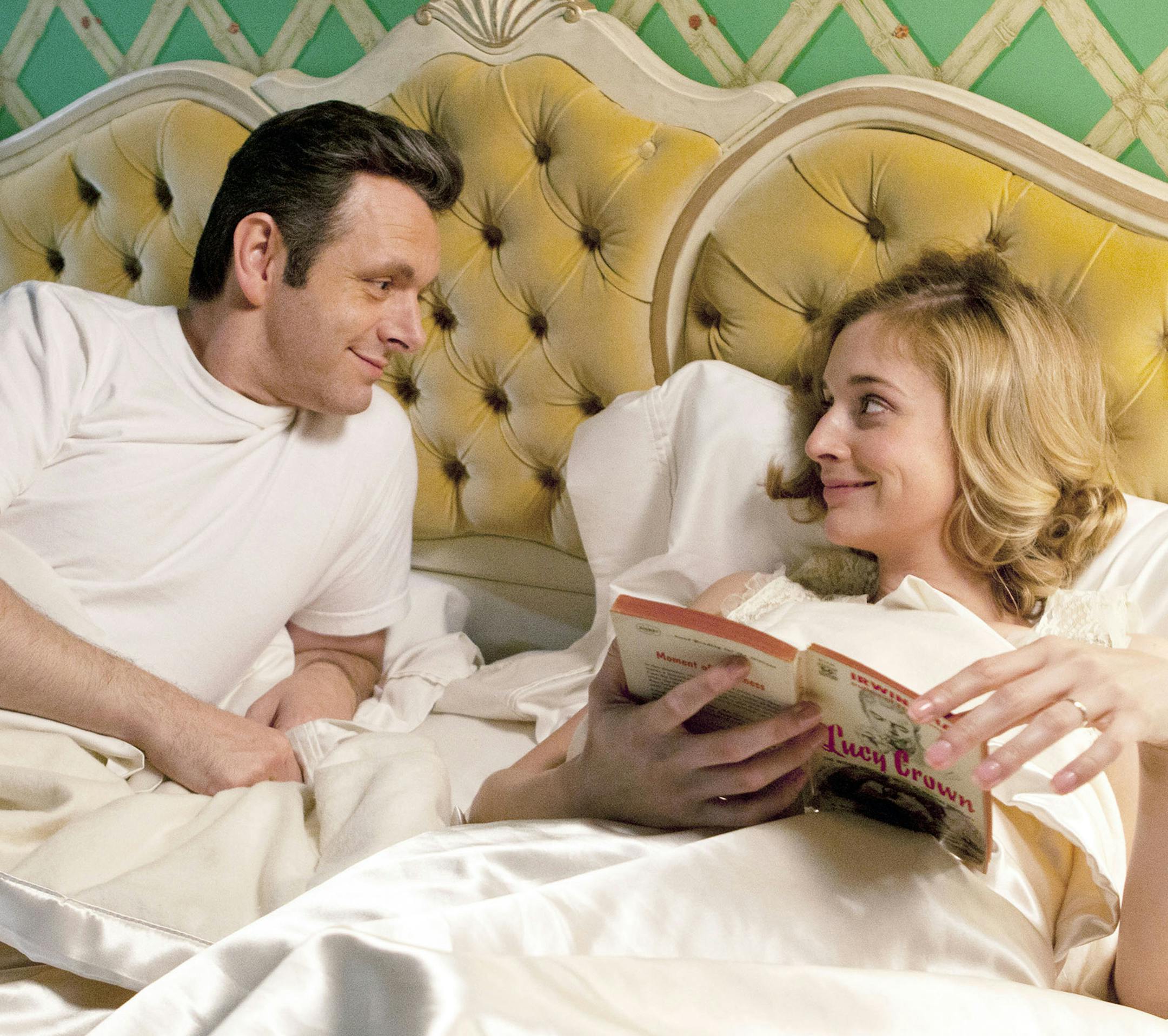 Michael Sheen as Dr. William Masters and Caitlin Fitzgerald as Libby Masters in "Masters of Sex." The difficult part about this show, says the executive producer Michelle Ashford, is making the love scenes not sexy. (Patrick Wymore/Showtime) ORG XMIT: 1172067