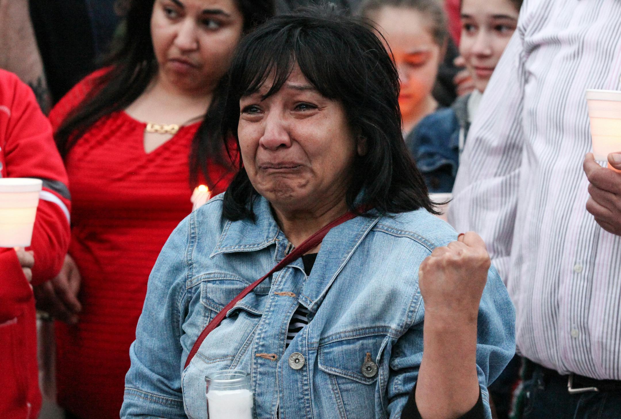 Juanita Hernandez, the sister of Anita Sprosty, who was injured in the shooting, was in tears when she gave a speech in the vigil. Sprosty's two daughters and her ex-husband were all killed. ] XAVIER WANG ¥ xavier.wang@startribune.com A vigil for memorizing the victims in the Friday's murder in Payne-Phalen neighborhood in St. Paul was holding Sunday April 9, 2017 at the side of Lake Phalen in St. Paul.