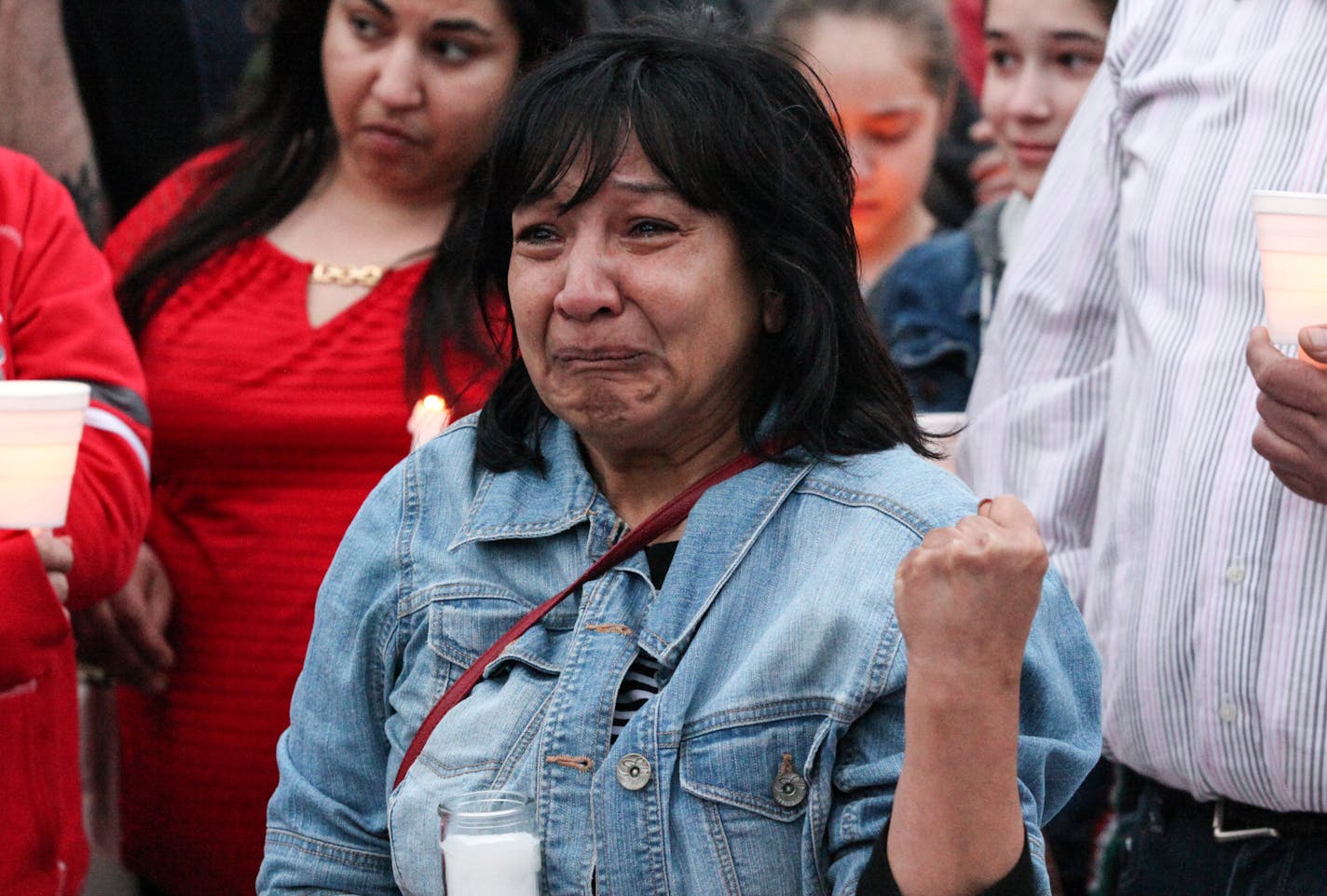 Juanita Hernandez, the sister of Anita Sprosty, who was injured in the shooting, was in tears when she gave a speech in the vigil. Sprosty's two daughters and her ex-husband were all killed. ] XAVIER WANG &#xa5; xavier.wang@startribune.com A vigil for memorizing the victims in the Friday's murder in Payne-Phalen neighborhood in St. Paul was holding Sunday April 9, 2017 at the side of Lake Phalen in St. Paul.