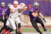 St. Thomas running back Jordan Roberts (23) cuts upfield in the first half as the University of St. Thomas Tommies hosted the Wabash College Little Gi