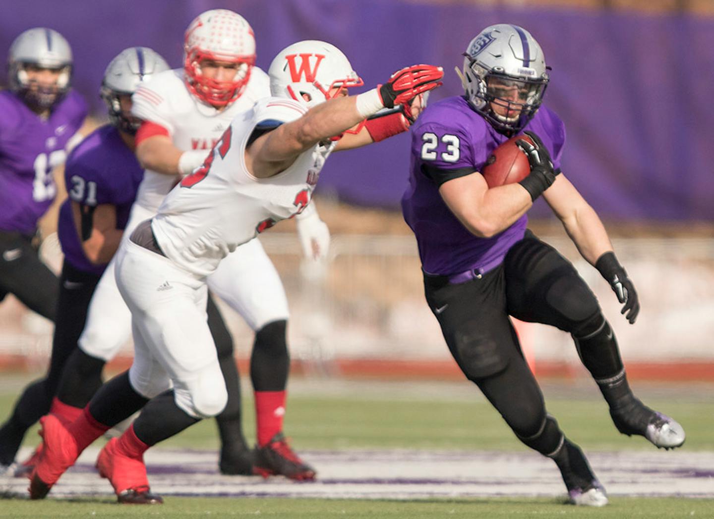 St. Thomas running back Jordan Roberts (23) cuts upfield in the first half as the University of St. Thomas Tommies hosted the Wabash College Little Giants on December 5, 2015.