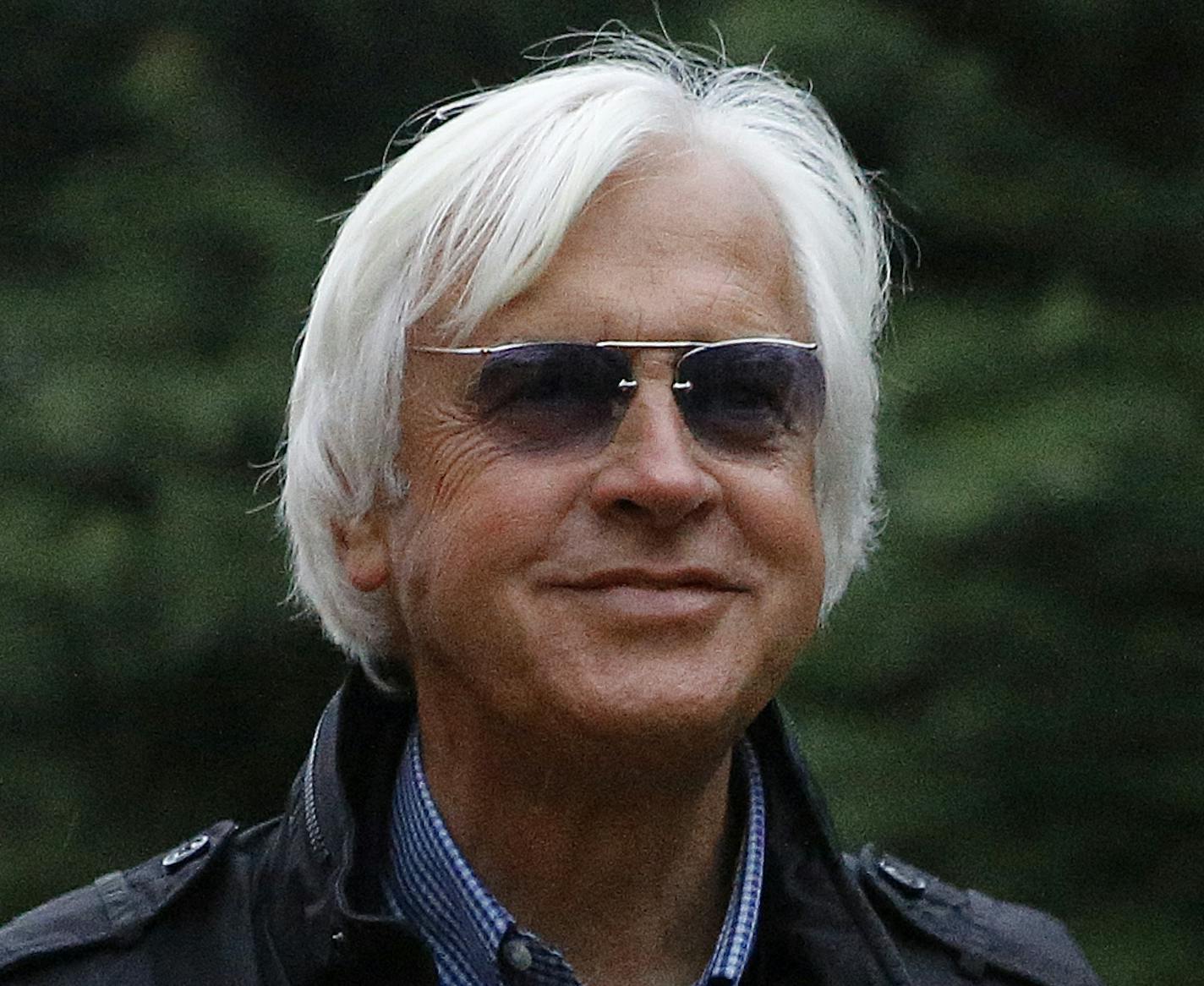 Bob Baffert, trainer of Kentucky Derby winner Justify, stands outside a barn, Friday, May 18, 2018, at Pimlico Race Course in Baltimore. The Preakness Stakes horse race is scheduled to take place Saturday, May 19. (AP Photo/Patrick Semansky)