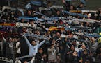 Minnesota United fans celebrate at the end of an MLS soccer match in Portland
