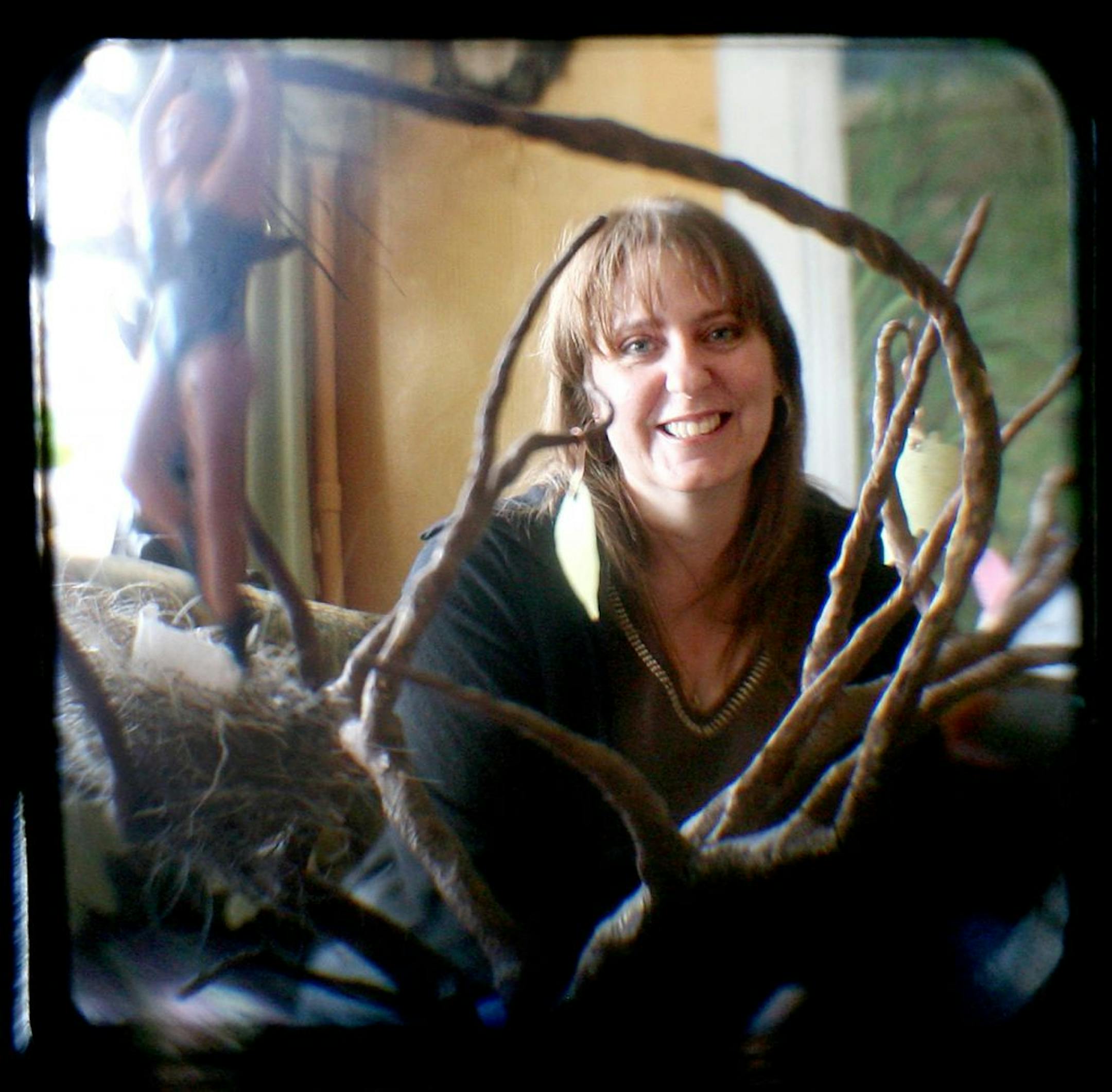 Artist Dawn-Marie deLara photographed in her home, Belle Ami, in Belle Plaine January 16, 2012. (Courtney Perry/Special to the Star Tribune) Photo taken with digital camera looking through the viewfinder of a twin lens reflex camera.
