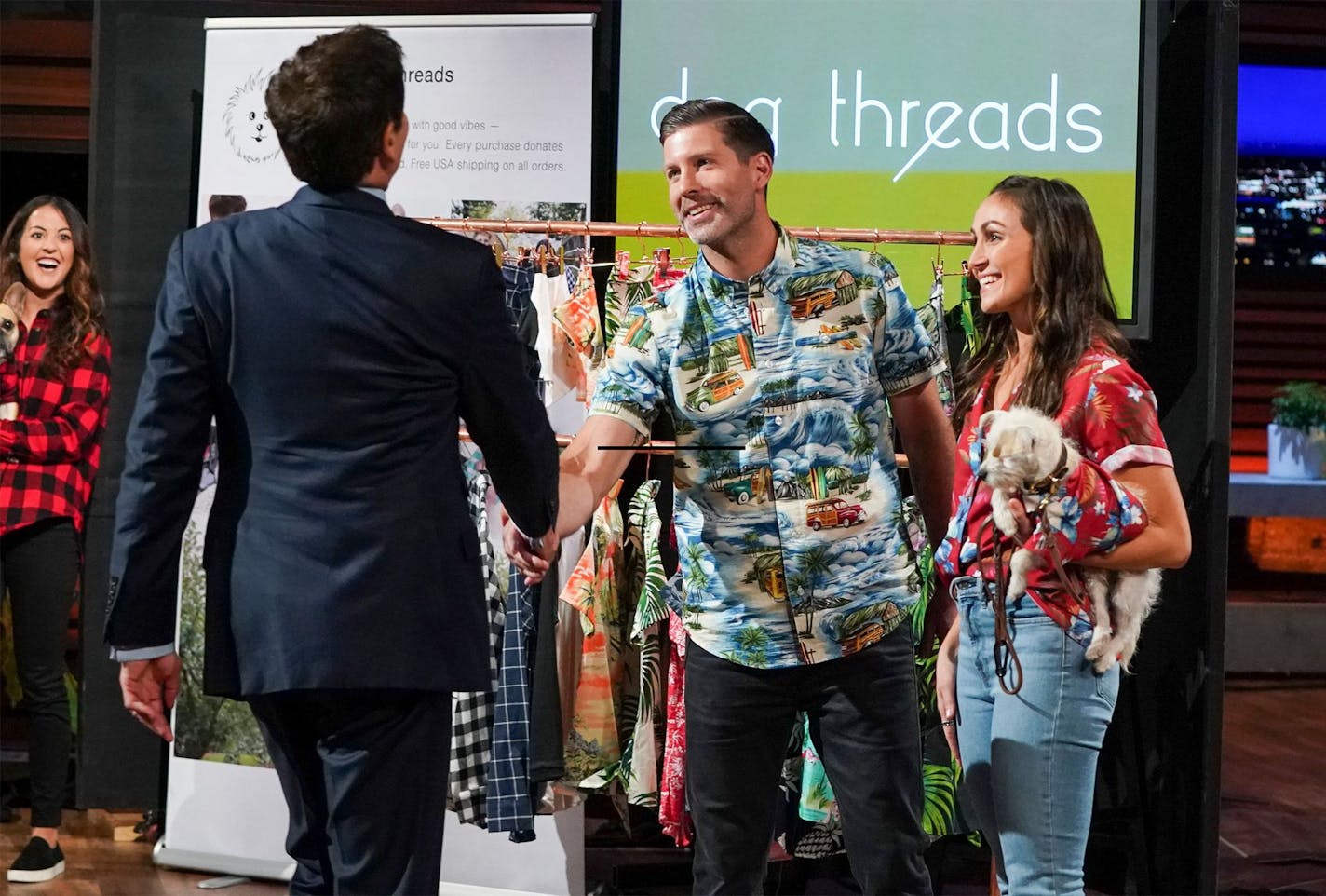 Mark Cuban congratulates Scott and Gina Gibson after agreeing to invest $250,000 in their company, Dog Threads, in turn for a 25% stake. (Provided by CNBC)