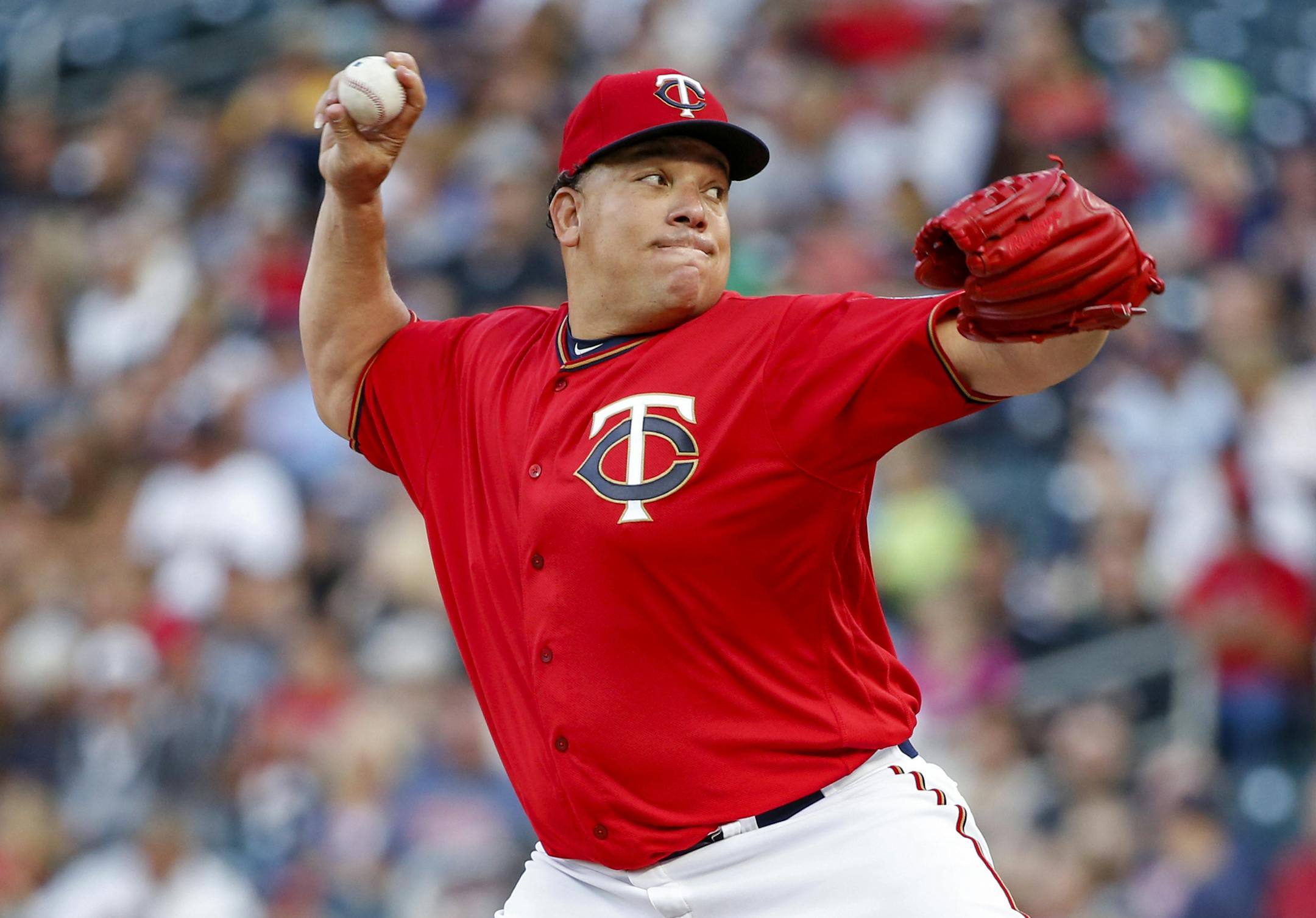 Minnesota Twins starting pitcher Bartolo Colon throws to the Texas Rangers in the first inning of a baseball game Friday, Aug. 4, 2017, in Minneapolis. (AP Photo/Bruce Kluckhohn)