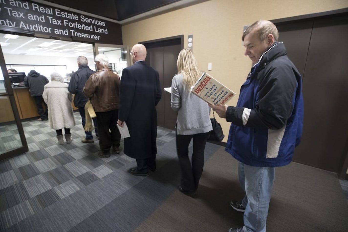 Joe Antonucci waited in line to pre pay his 2018 property tax Wednesday December 27, 2017 in Minneapolis, MN.