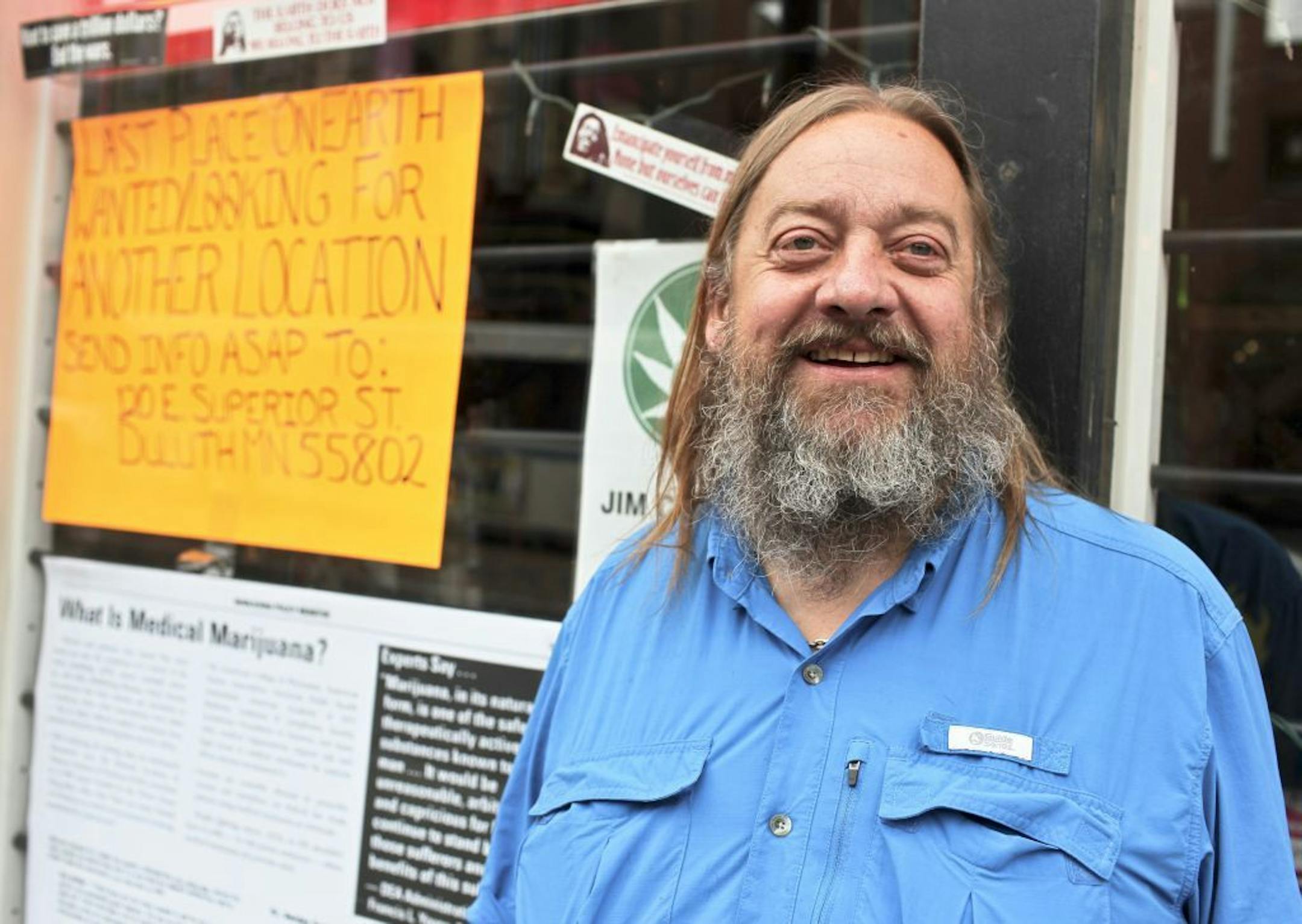 In this Aug. 28, 2013 photo, Jim Carlson, store owner of the Last Place on Earth, poses for a photo near his business in Duluth, Minn. The owner of a synthetic drugs store that has bedeviled downtown Duluth said he could be back in business in a new location as early as next week.