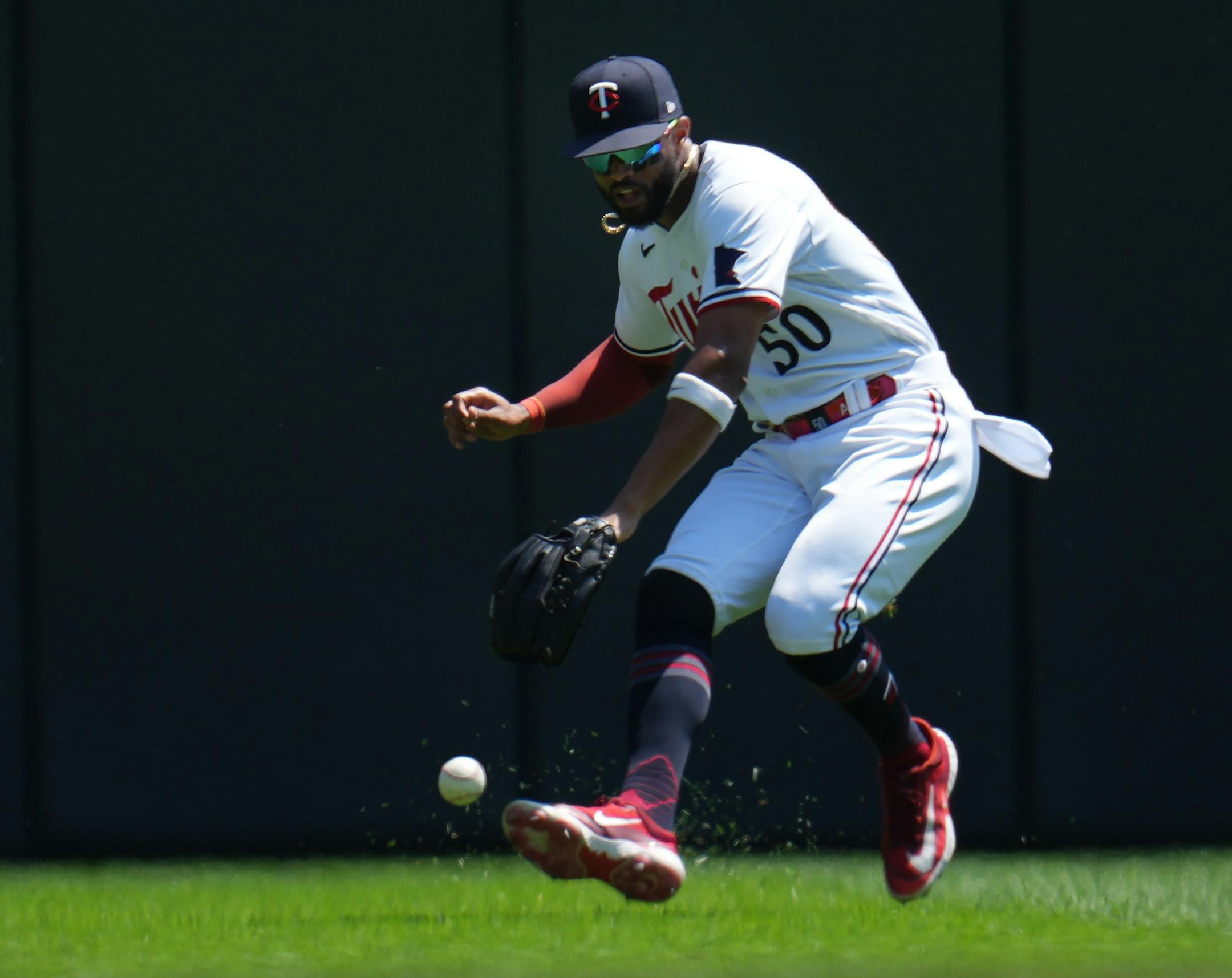 Minnesota Twins left fielder Willi Castro (50) fields a single from Seattle Mariners right fielder Teoscar Hernandez (35) in the first inning.