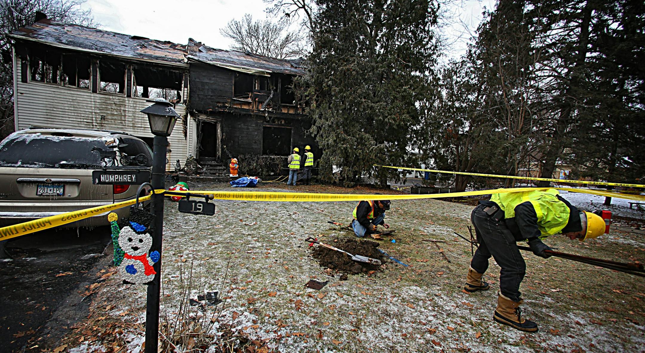 Utility workers and fire officials, remained at the scene of a fire in Minnetonka late Saturday morning, at #19 Westwood Road, where two bodies were found. The fire was called in to the Minnetonka Fire Department at about 10:30 PM Friday night.