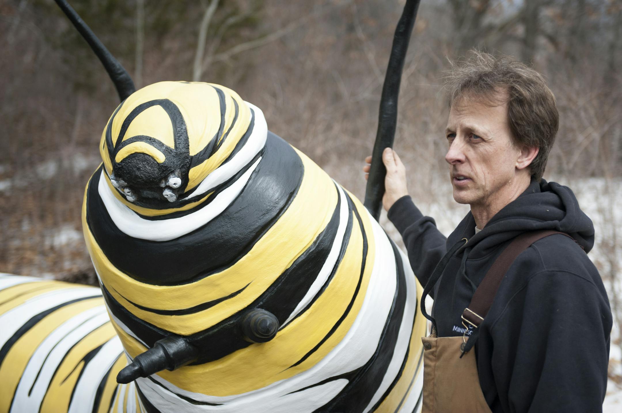 Rick Oestreich, one of the lead builders of the sculptures and natural artwork at the Zoo, talks about the construction of this 3,000 lb Monarch caterpillar for the Minnesota Zoo's Big Bug exhibit which is set to open on May 24, 2014. ] Photo by Leslie Plesser ‚Ä¢ Special to the Star Tribune ORG XMIT: MIN1404011217430890