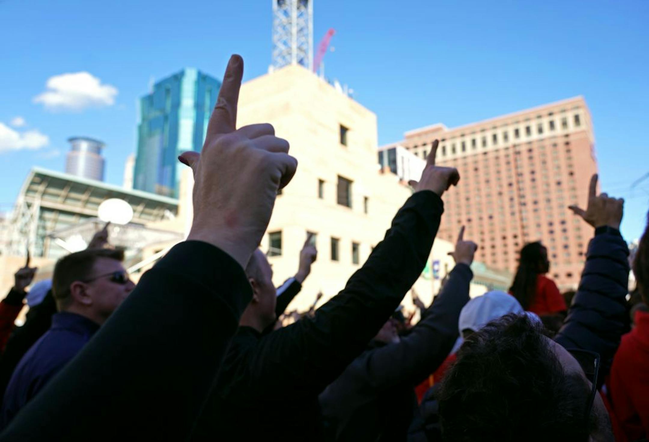 The "Guns were up" for Texas Tech fans celebrating on Nicollet Mall pep rally before the big match with Virginia for the national championship.
