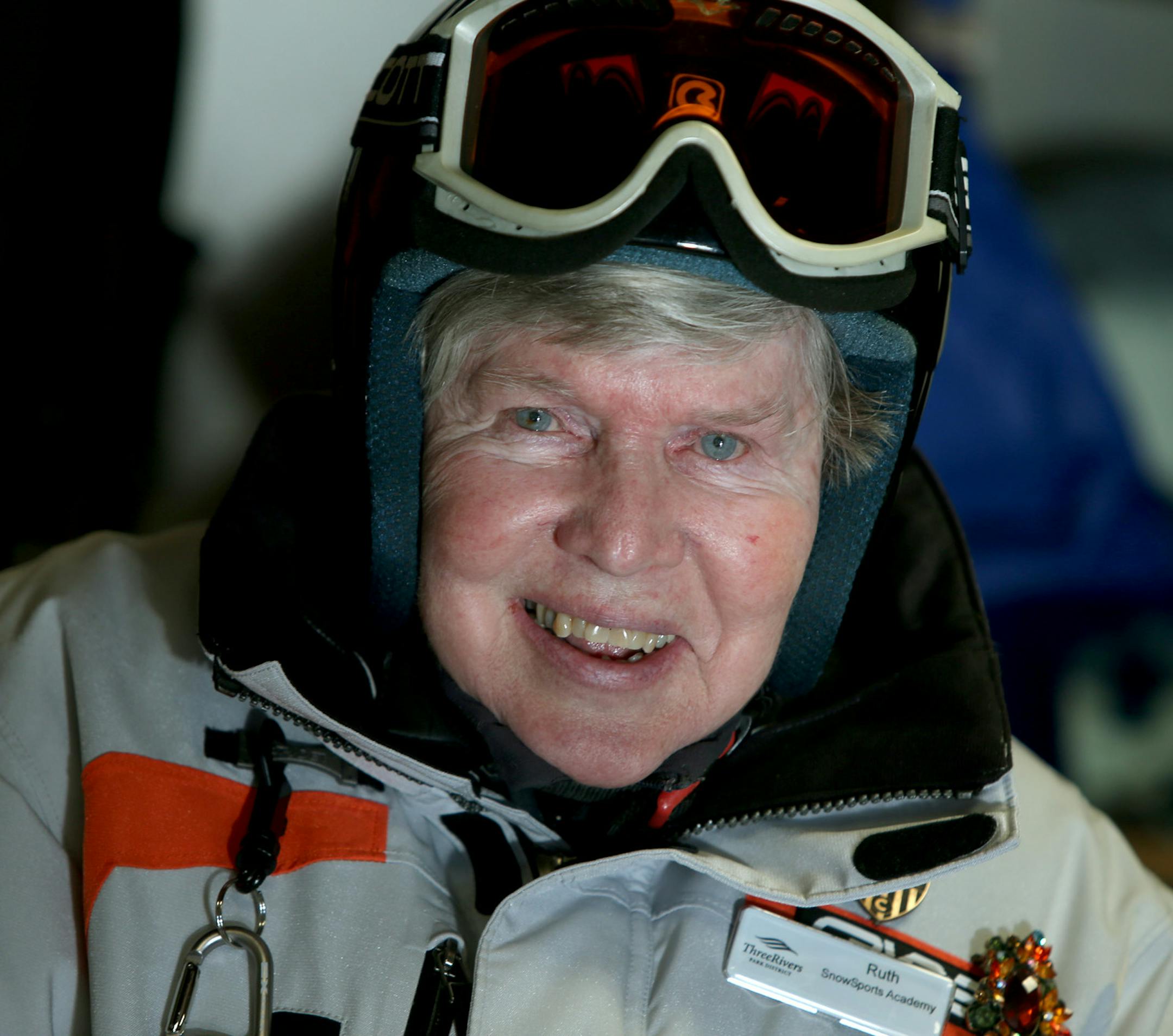 Ruth Lyons, a 79-year-old ski instructor, put on her coat and helmet before giving lessons at the Hyland Hills Ski Area, Thursday, January 9, 2014 in Bloomington, MN. (ELIZABETH FLORES/STAR TRIBUNE) ELIZABETH FLORES • eflores@startribune.com