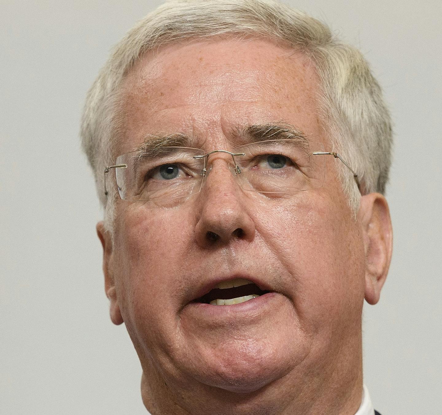 FILE - In this Oct. 12, 2017 file photo, Britain's Defense Secretary, Michael Fallon, addresses members of the media during a joint UK/Poland press conference in the Foreign and Commonwealth Office in London. Fallon resigned after he was accused of inappropriate advances on two women. (Leon Neal/Pool Photo via AP, File)