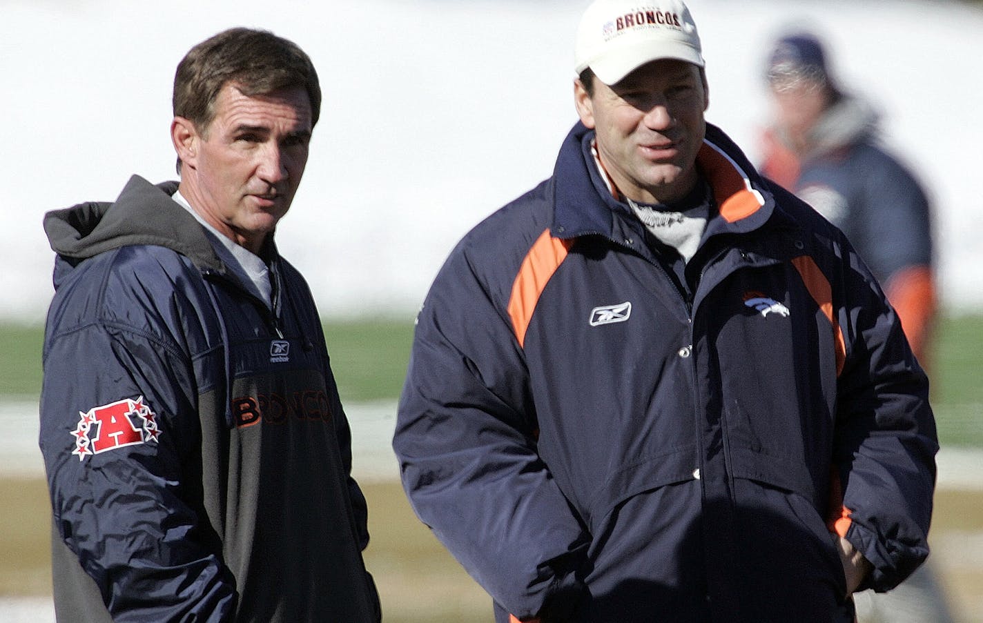 Denver Broncos head coach Mike Shanahan, left, and offensive coordinator Gary Kubiak watch their team during practice at the Broncos training facility in Denver on Friday, Jan. 20, 2006. The Broncos hots the Pittsburgh in the AFC Championship game on Sunday. (AP Photo/Ed Andrieski) ORG XMIT: COEA103