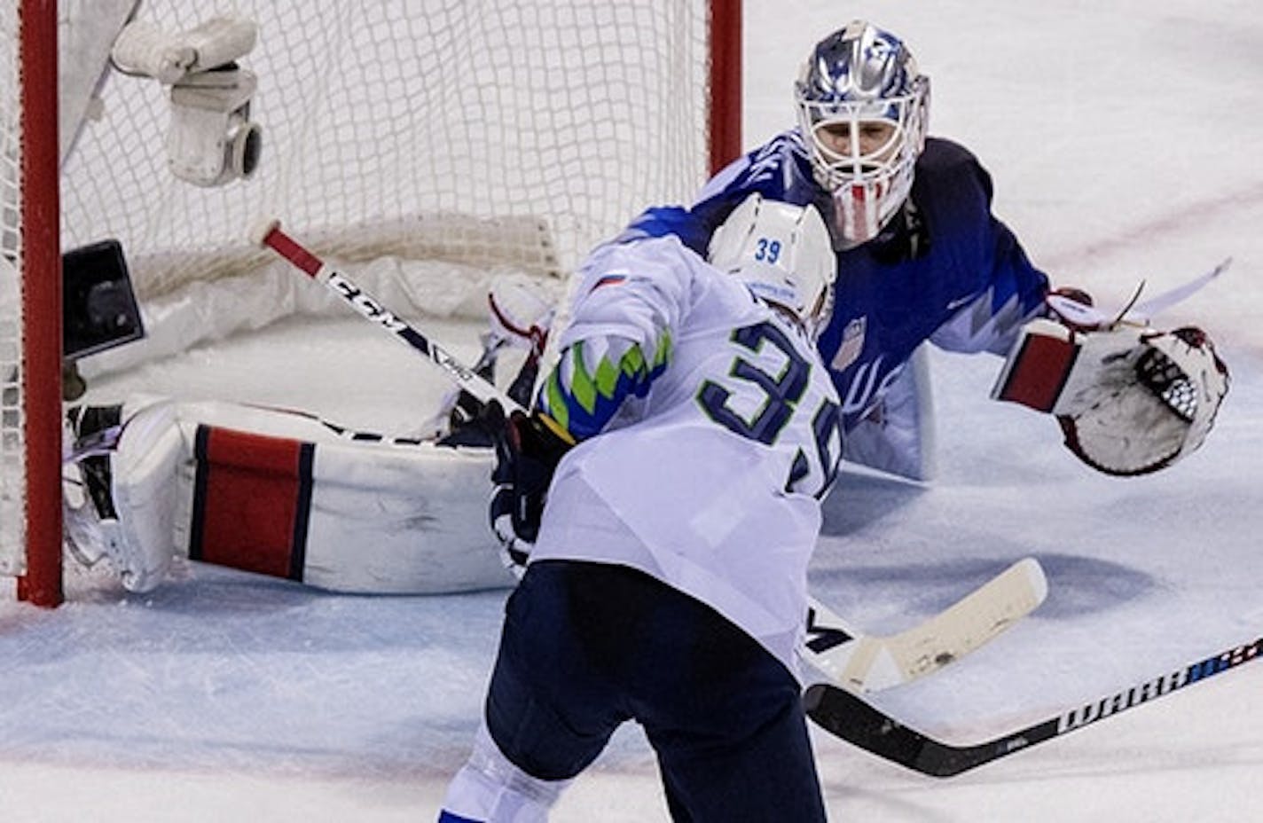 Jan Mursak (39) shot the puck past USA goalie Ryan Zapolski (30) for a game winning goal in overtime.