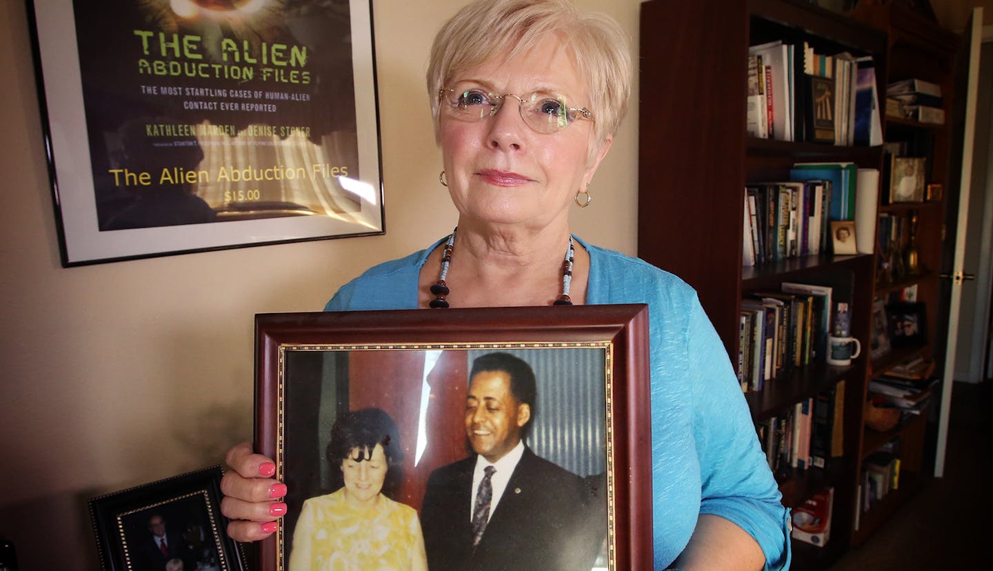 Kathleen Marden holds a picture of her aunt, Betty Hill, and her uncle, Barney Hill, at her home in Kissimmee, Fla., on February 4, 2019. The Hill's account of their alleged alien abduction, that they said happened in the White Mountains in New Hampshire in 1961, gained national attention when it was made public in 1965. (Rich Pope/Orlando Sentinel/TNS)