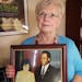 Kathleen Marden holds a picture of her aunt, Betty Hill, and her uncle, Barney Hill, at her home in Kissimmee, Fla., on February 4, 2019. The Hill's a