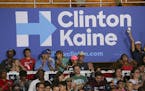Supporters beneath a campaign sign during a rally for Hillary Clinton and her running mate Sen. Tim Kaine of Virginia at Florida International Univers