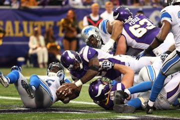 Minnesota Vikings running back Adrian Peterson (28)scored on a two point conversion in the fourth quarter during NFL action between the Detroit Lions 