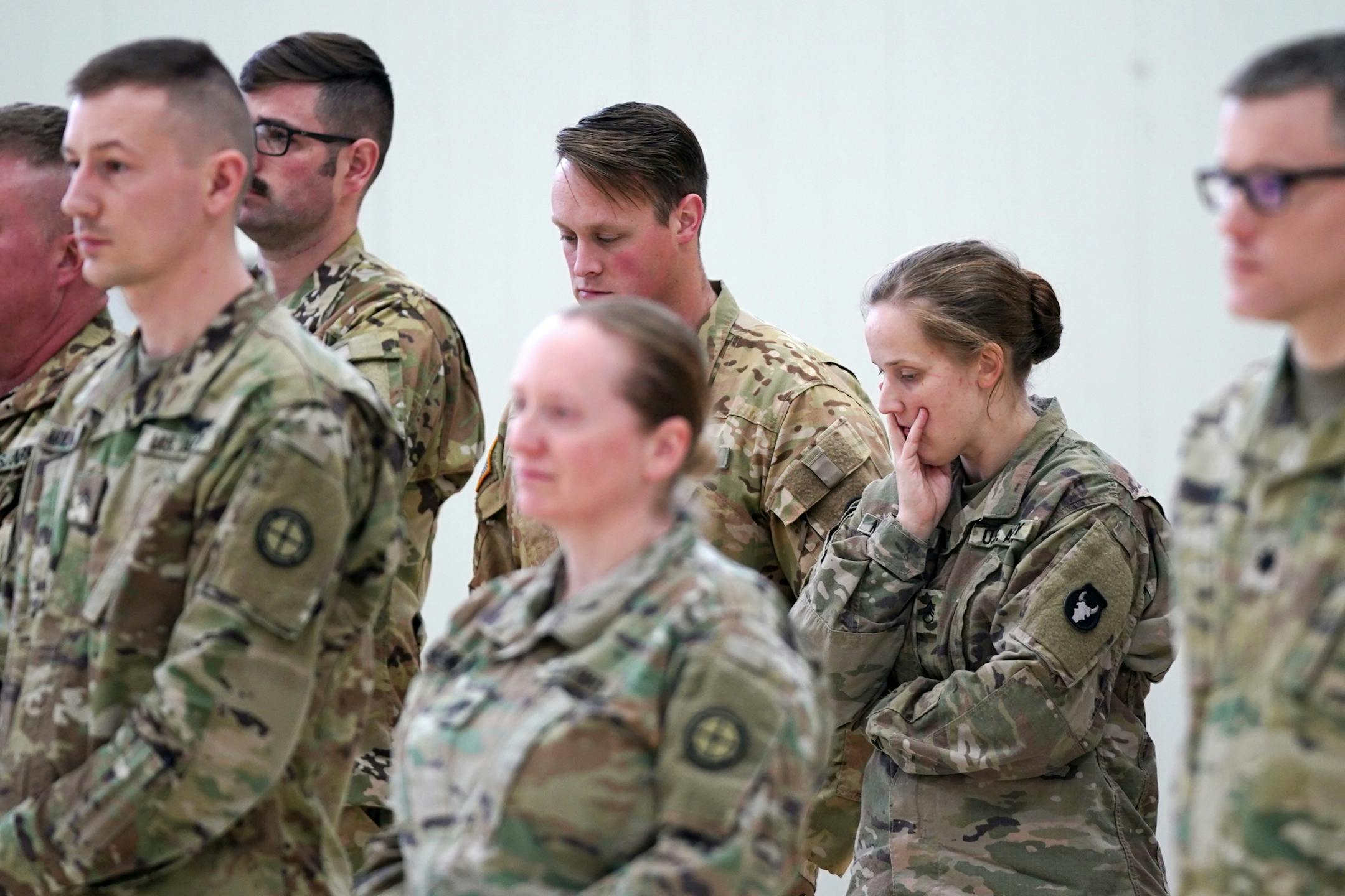 National Guard soldiers somberly listened as Maj. Gen. Jon Jensen spoke during Saturday's press conference.