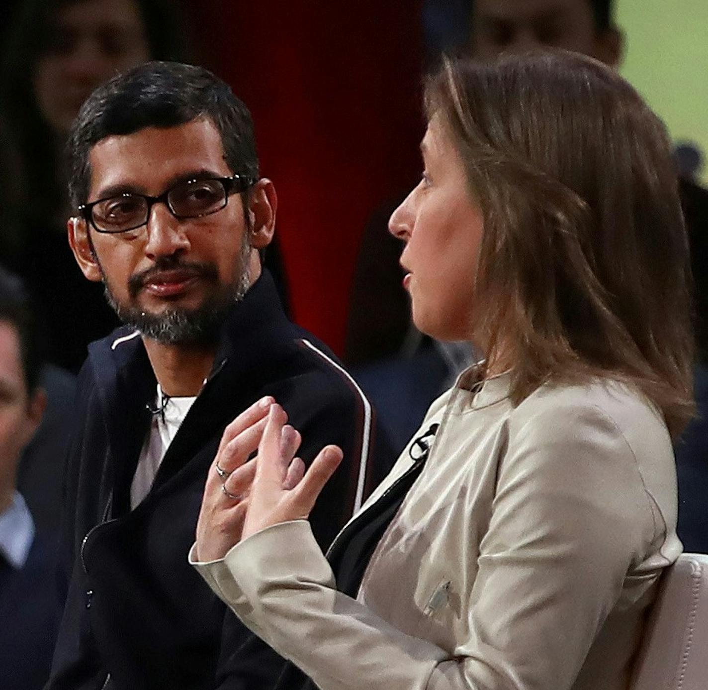 YouTube CEO Susan Wojcicki, right, gestures beside Google CEO Sundar Pichai during the taping of a television program on Friday, Jan. 19, 2018, in San Francisco. (AP Photo/Ben Margot) ORG XMIT: CABM102