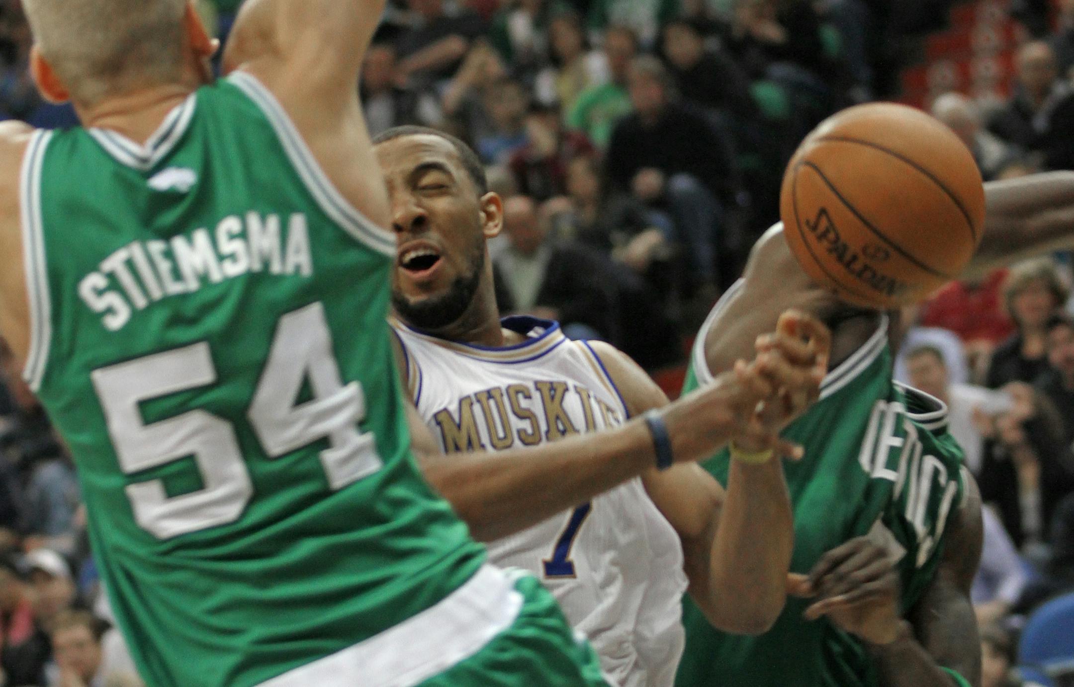 Minnesota Timberwolves vs. Boston Celtics, Target Center, 3/30/12. (left to right) Boston's Greg Stiemsma defended as Minnesota's Derrick Williams lost control of the ball.