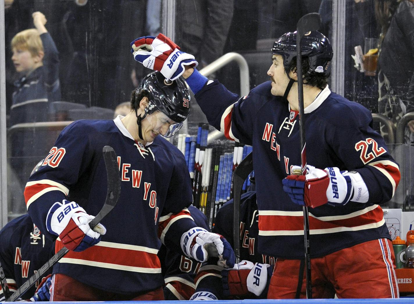 New York Rangers' Brian Boyle, right, celebrates with Chris Kreider after Kreider scored during the third period of an NHL hockey game against the Vancouver Canucks Saturday, Nov. 30, 2013, at Madison Square Garden in New York. It was Kreider's third goal for a hat trick and the Rangers won 5-2. (AP Photo/Bill Kostroun)