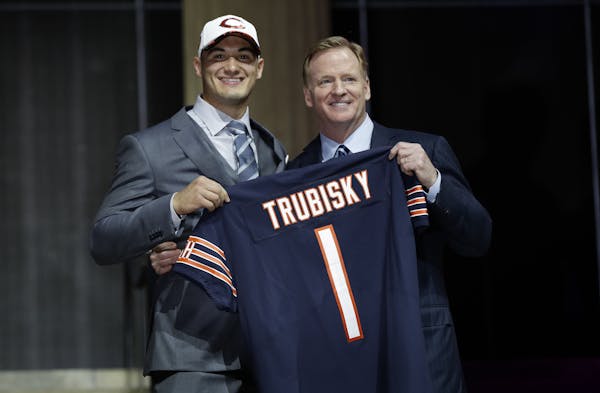 North Carolina's Mitch Trubisky, left, poses with NFL commissioner Roger Goodell after being selected by the Chicago Bears during the first round of t