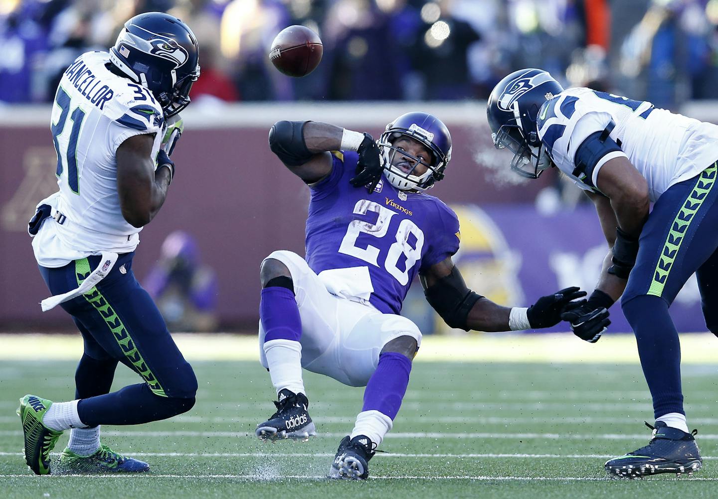 Kam Chancellor (31) stripped the ball away from Vikings running back Adrian Peterson (28) in the fourth quarter. ] CARLOS GONZALEZ &#x2022; cgonzalez@startribune.com - January 10, 2016, Minneapolis, MN, TCF Bank Stadium, NFL, Minnesota Vikings vs. Seattle Seahawks