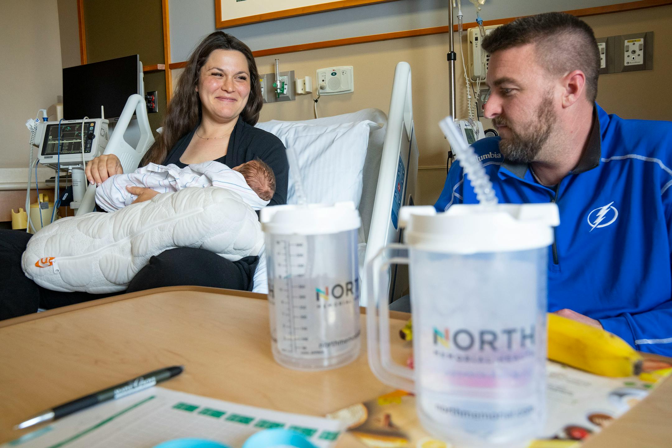 Emily McDonagh holds her newborn daughter, Clare, while her husband, Colin, looks on Thursday, March 24, 2022 at Maple Grove Hospital in Maple Grove, Minn.