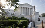 Security guards the Supreme Court in Washington, Thursday June 25, 2015. The court is expected to hand down decisions today. Two major opinions, healt