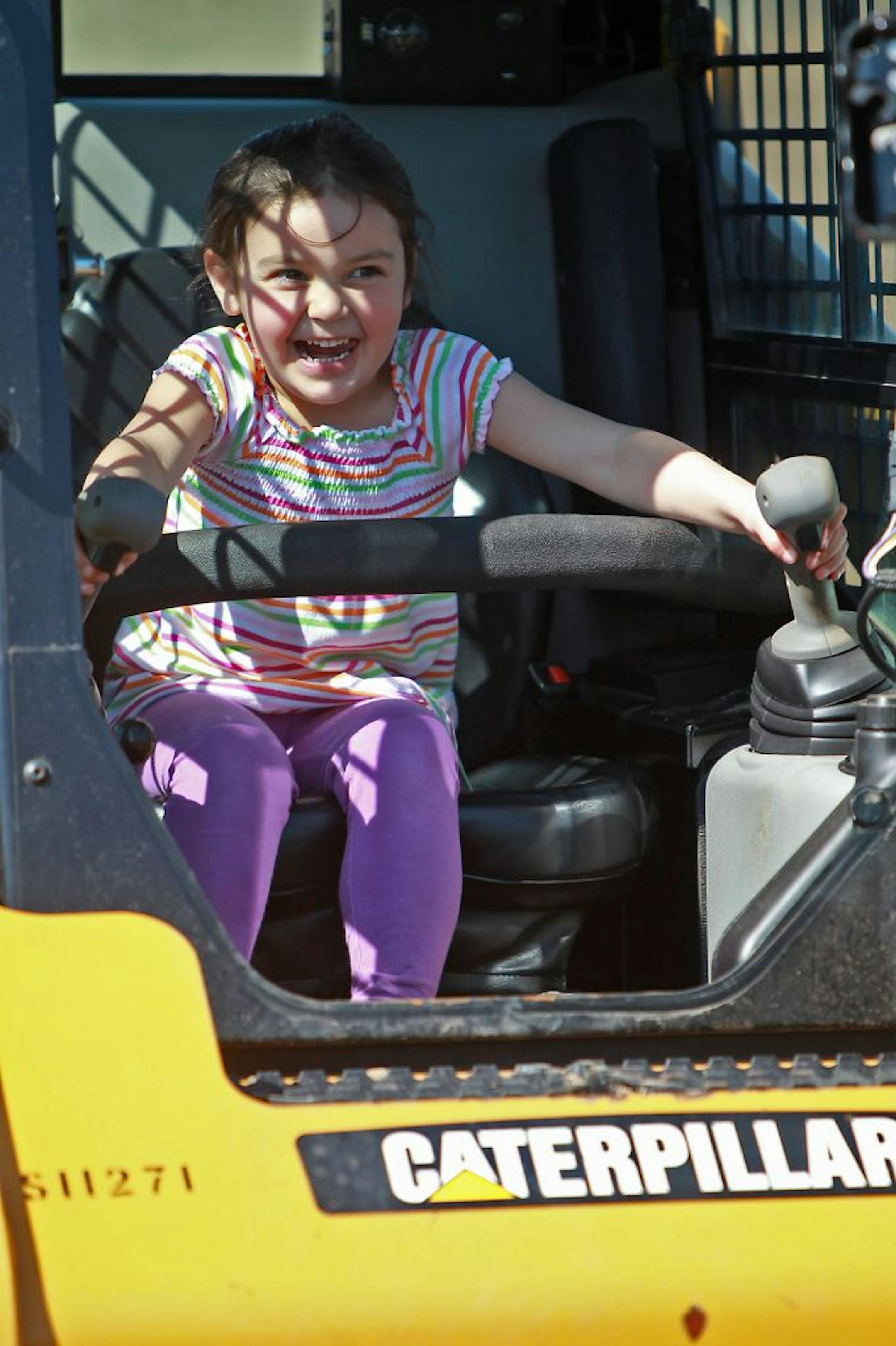 "Extreme Sandbox" client Dave Nowlin's daughter Lily Nowlin, 4, play on equipment before he learned how to use the machinery during a course Tuesday, April 24, 2012 in Hastings MN. (ELIZABETH FLORES/STAR TRIBUNE) ELIZABETH FLORES � eflores@startribune.com