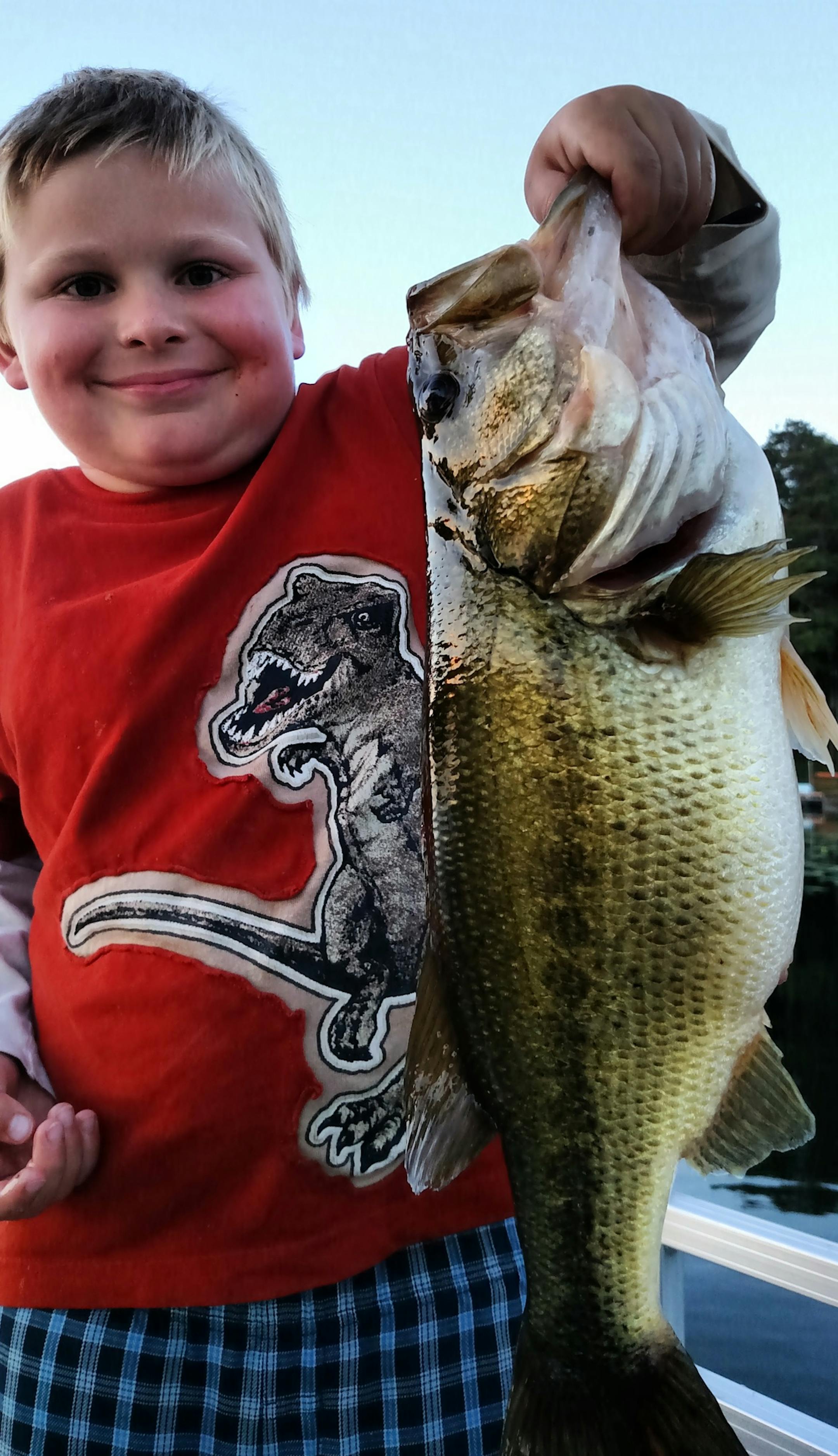 Dylan Rengstorf, 8, of Little Canada, caught this 19-inch, 4Ω-pound bass on a metro area lake at dusk last week using a Power Worm.