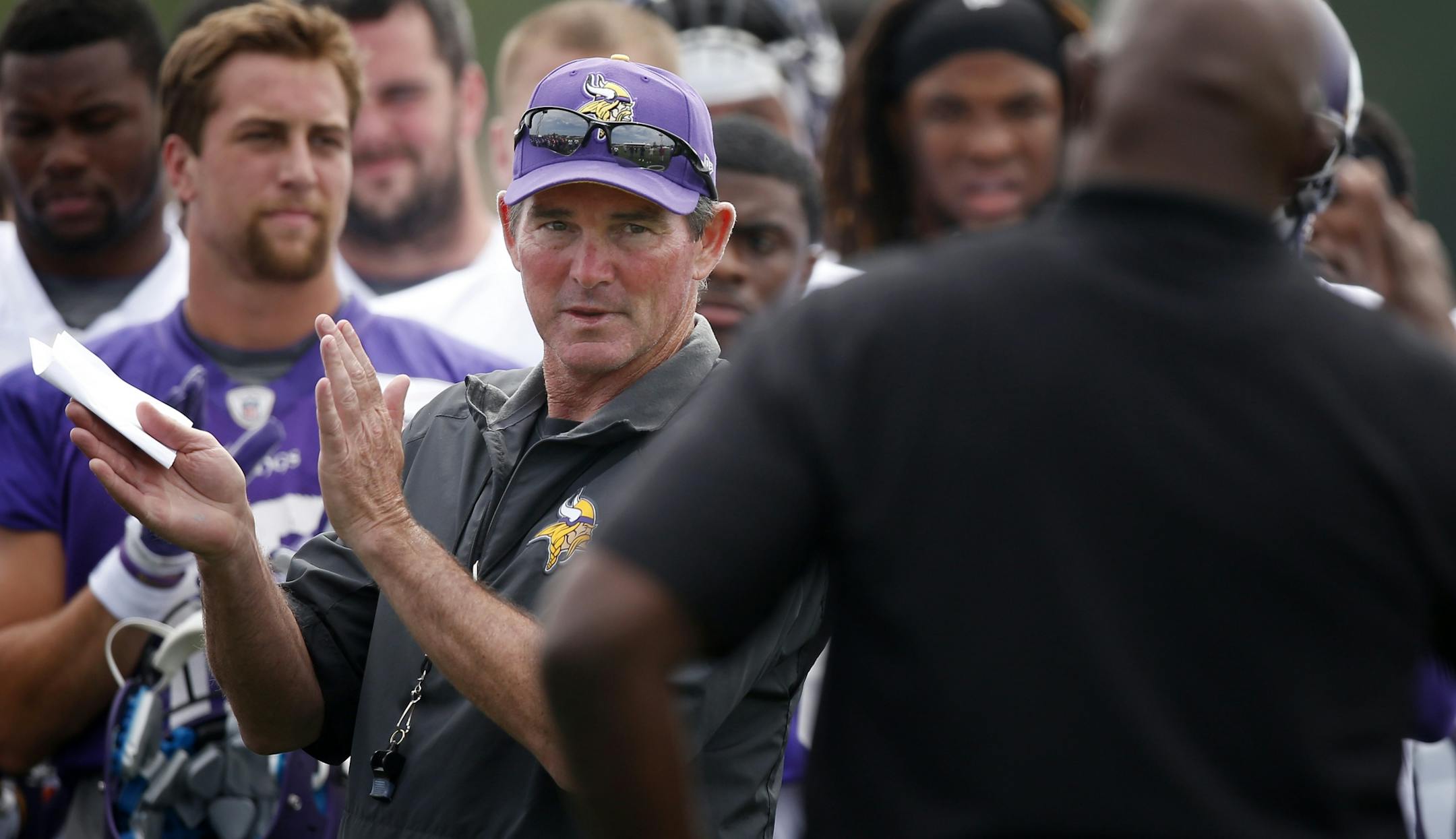 Minnesota Vikings head coach Mike Zimmer applauded alumni players that were visiting practice on Thursday.