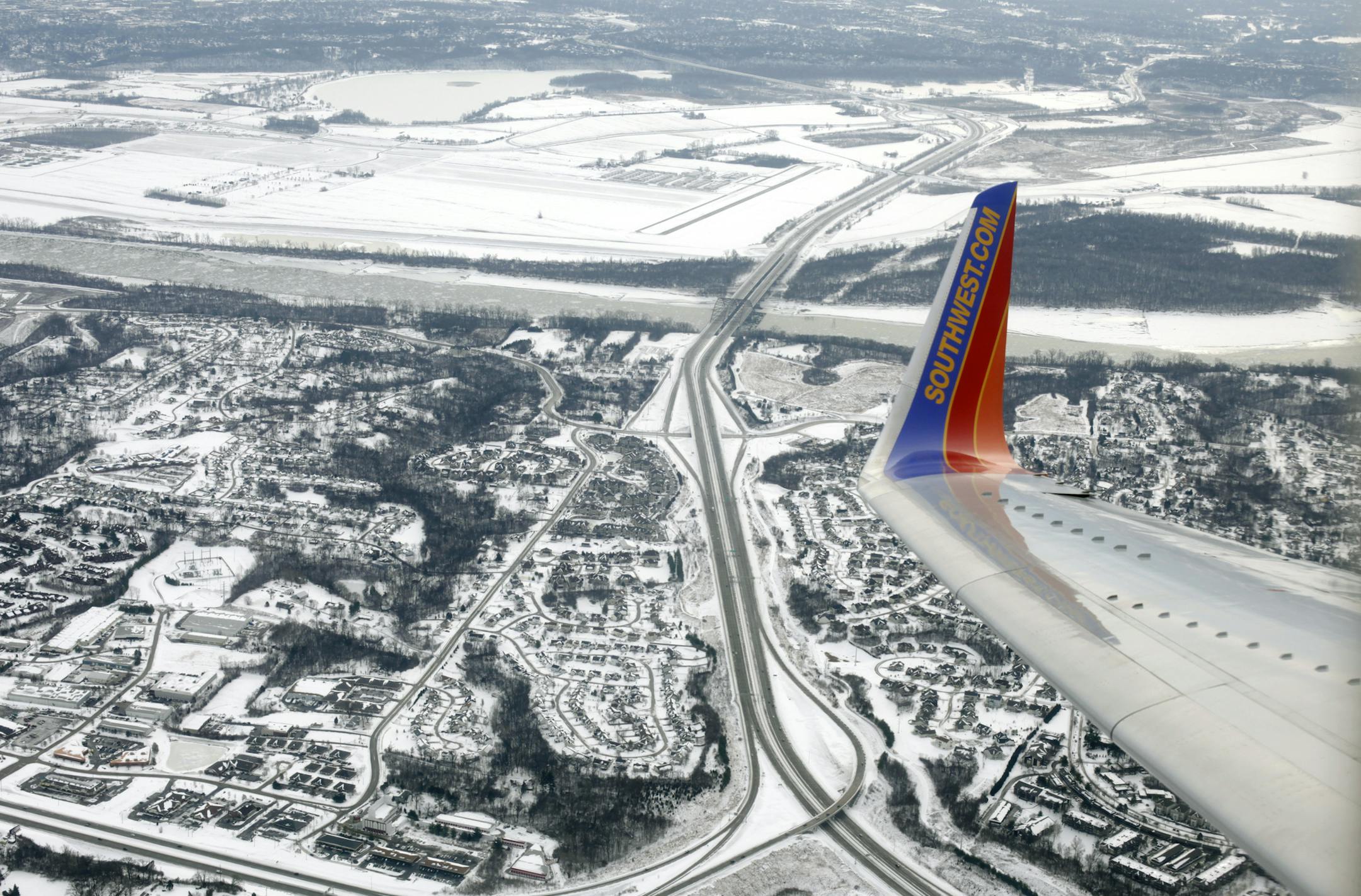 In this Wednesday, Jan. 8, 2014, photo, a Southwest plane approaches LambertñSt. Louis International Airport in St. Louis. Southwest Airlines Co. is expanding beyond the continental United States with flights to the Caribbean beginning July 1. (AP Photo/Kiichiro Sato)