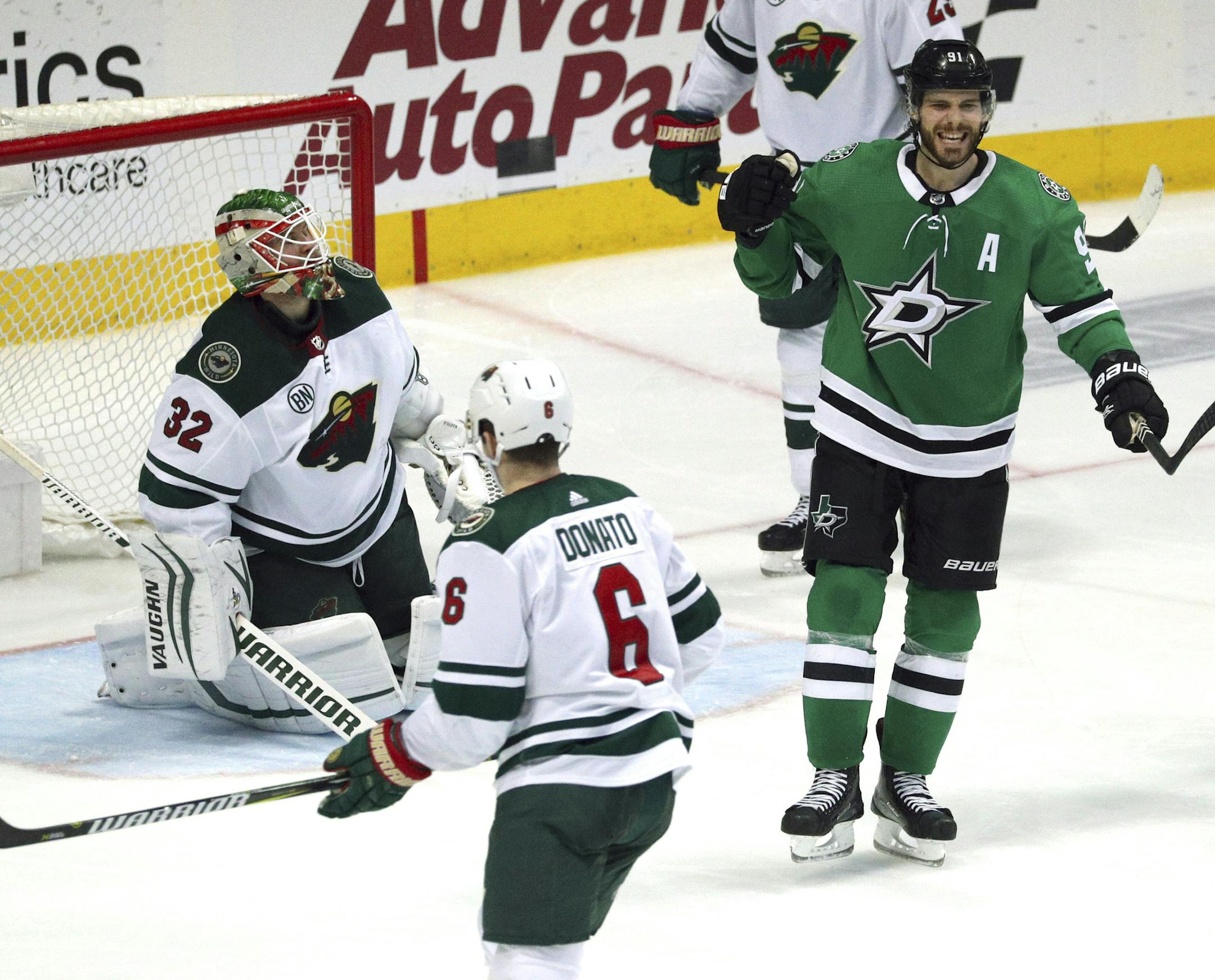 Dallas Stars center Tyler Seguin (91) celebrates his third-period goal against Minnesota Wild goaltender Alex Stalock (32) in an NHL hockey game Saturday, April 6, 2019, in Dallas. (AP Photo/Richard W. Rodriguez)