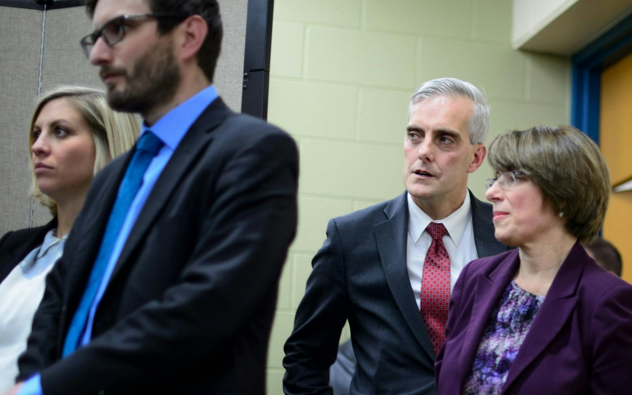 White House chief of staff Denis McDonough stood by Senator Amy Klobuchar before speaking at a news conference. On the left are State Reps Carly Melin and Jason Metza