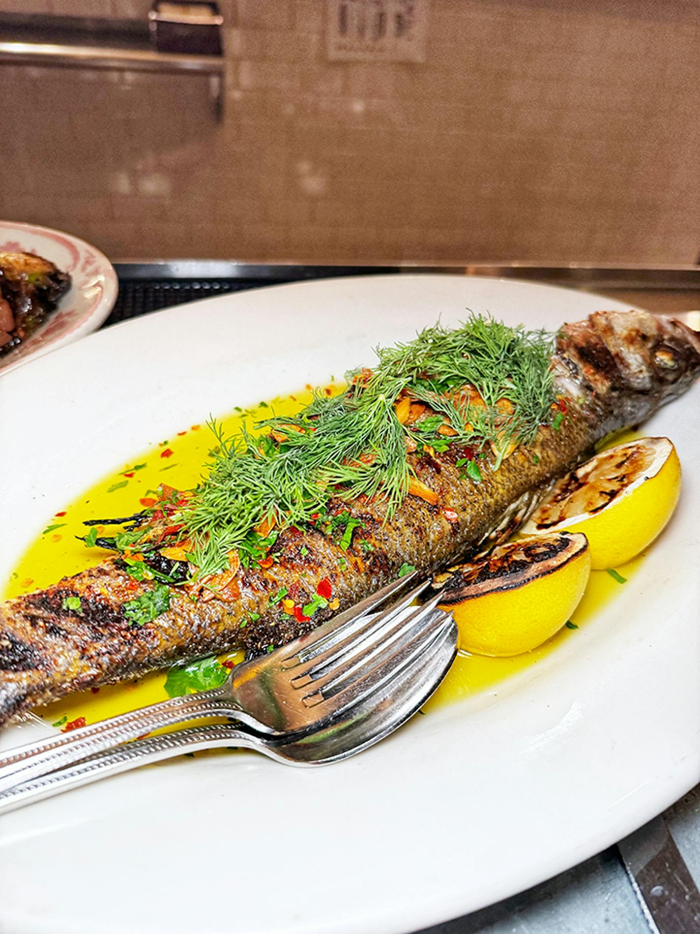 Branzino at Bar La Grassa. Credit: Jon Cheng