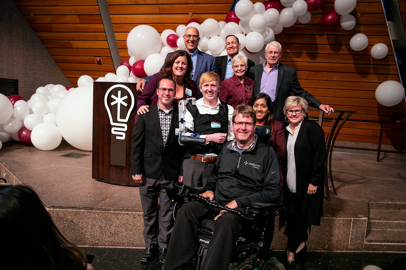 Founder Angie Conley, (middle row, left) and members of her Abilitech Medical team, as well as Minnesota Cup officials and judges, won the grand prize of $50,000 among nine finalists honored Monday night in ceremonies also sponsored by the Carlson School of Management at the University of Minnesota. Photo: Craig Bares