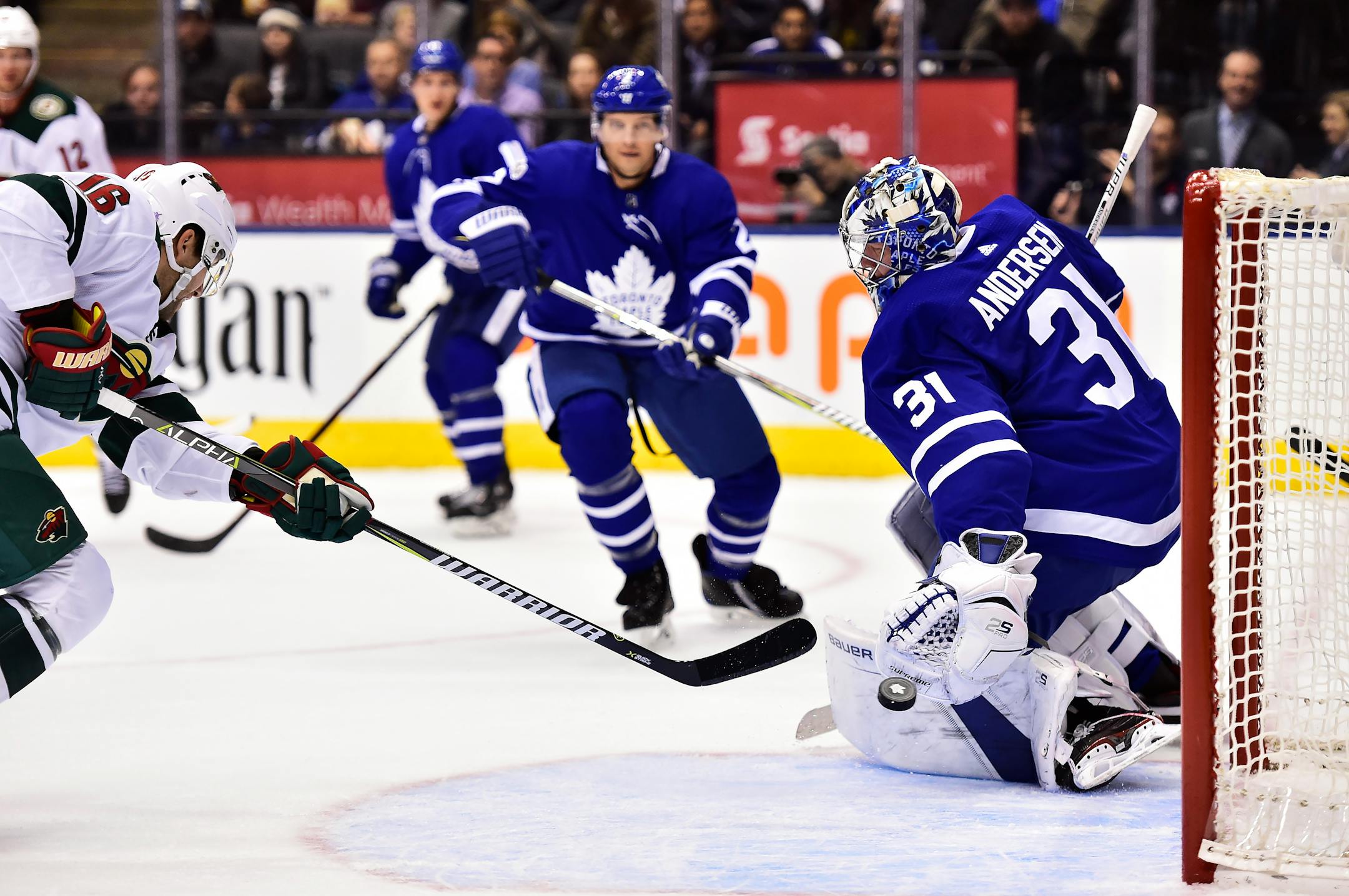 Minnesota Wild left wing Jason Zucker (16) scores on Toronto Maple Leafs goalie Frederik Andersen (31) during the first period of an NHL hockey game Wednesday, Nov. 8, 2017, in Toronto. (Frank Gunn/The Canadian Press via AP)
