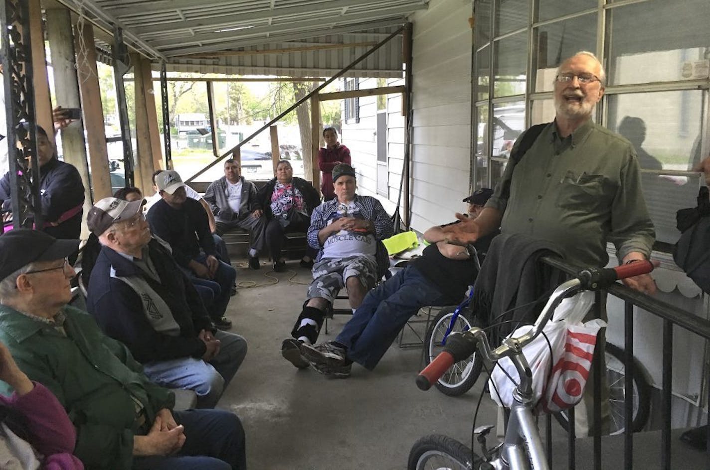 Attorney Jack Cann, who represents the Lowry Grove Residents Association, explains Monday's court ruling to homeowners. Photo by Hannah Covington