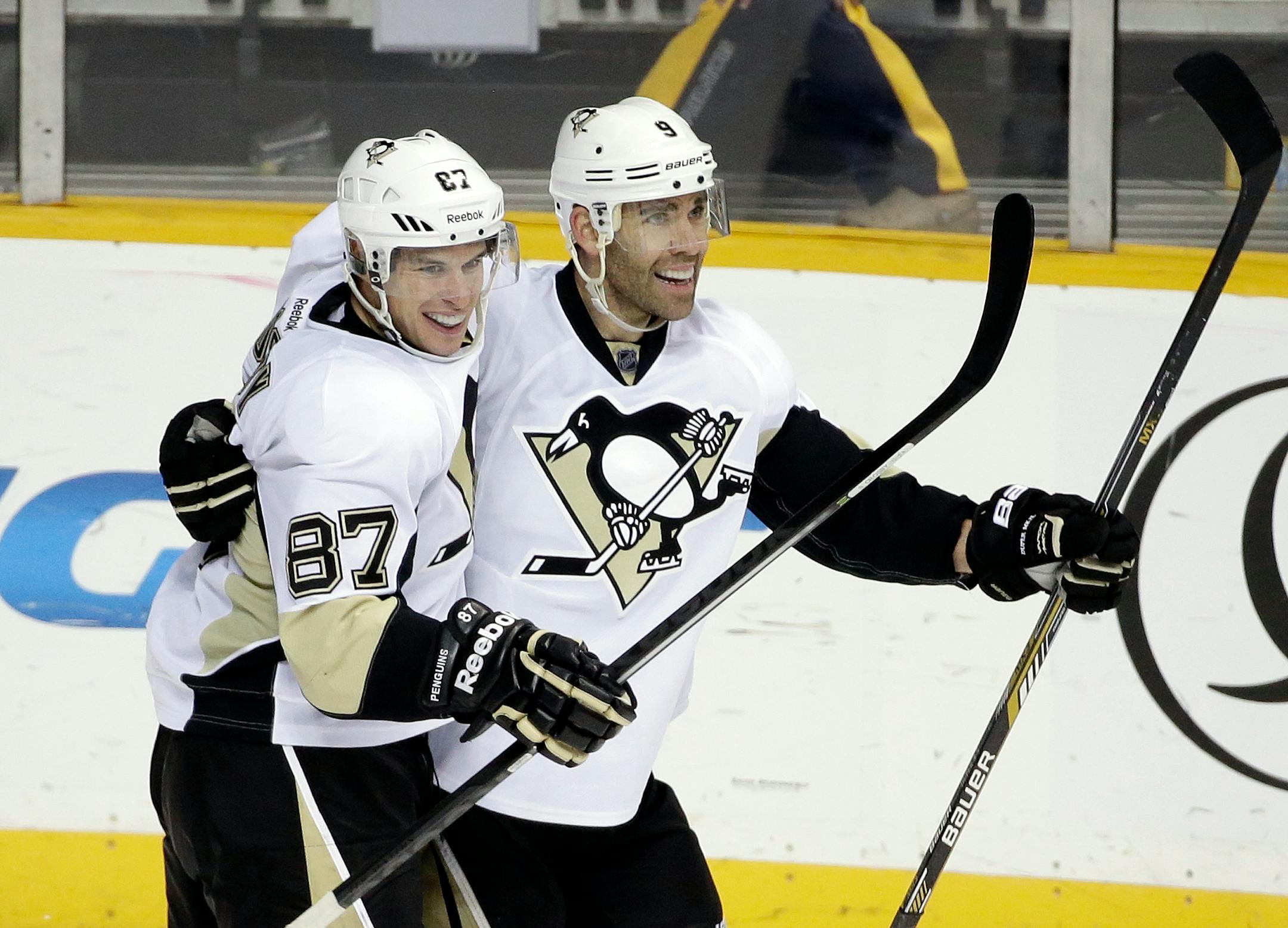 Pascal Dupuis (right) celebrates with Sidney Crosby after Dupuis scored a goal against the Predators in 2014.