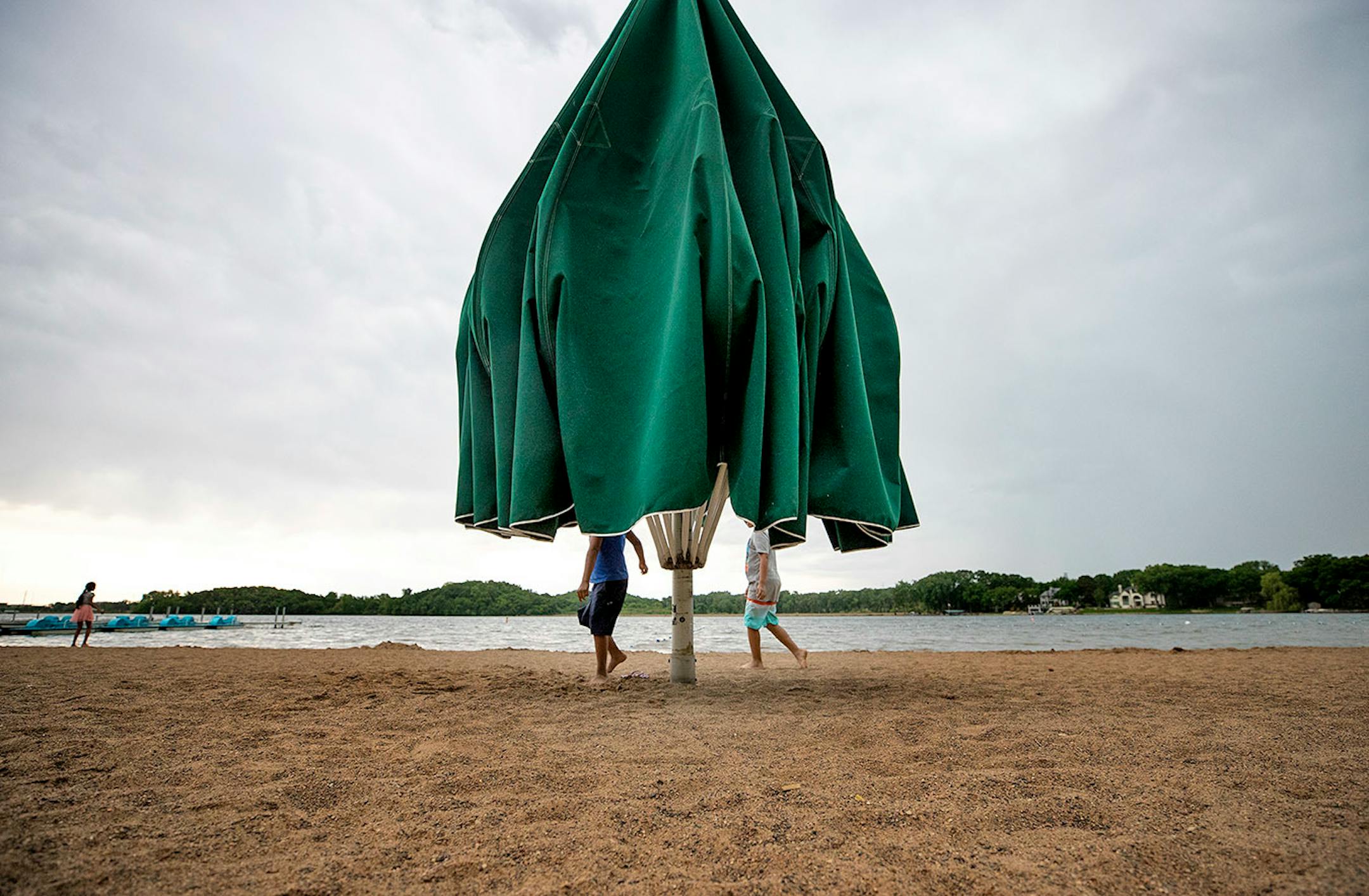Alex Cardoso, 8, of Fridley and Adrian Hilguera, 11, of Hopkins played in the sand at Bryant Lake Regional Park in Eden Prairie.