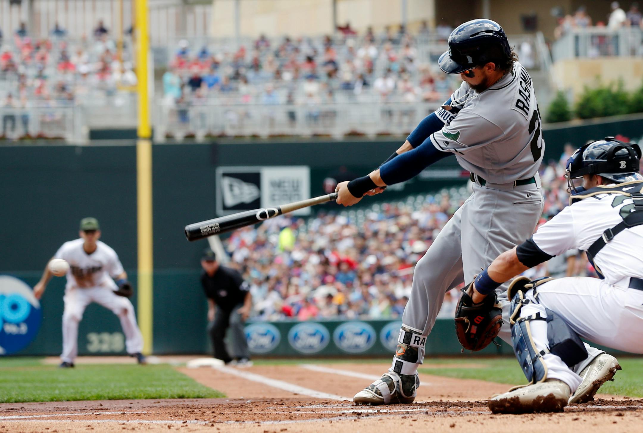 Tampa Bay Rays' Colby Rasmus hits an RBI-single off Minnesota Twins pitcher Kyle Gibson in the first inning of a baseball game Sunday, May 28, 2017, in Minneapolis. (AP Photo/Jim Mone)