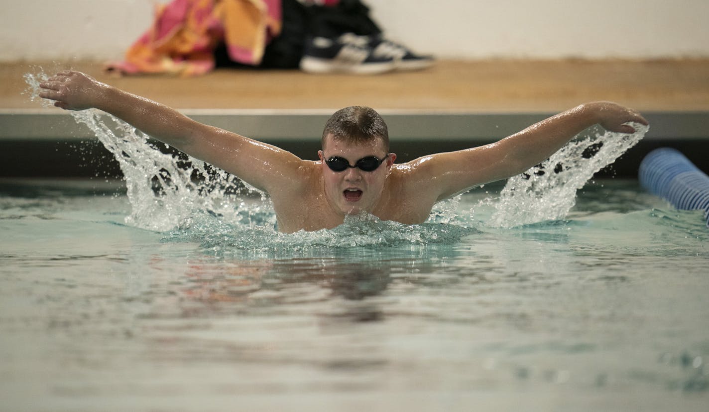 Roman Adams, 21, swam the butterfly stroke during a Saturday workout.