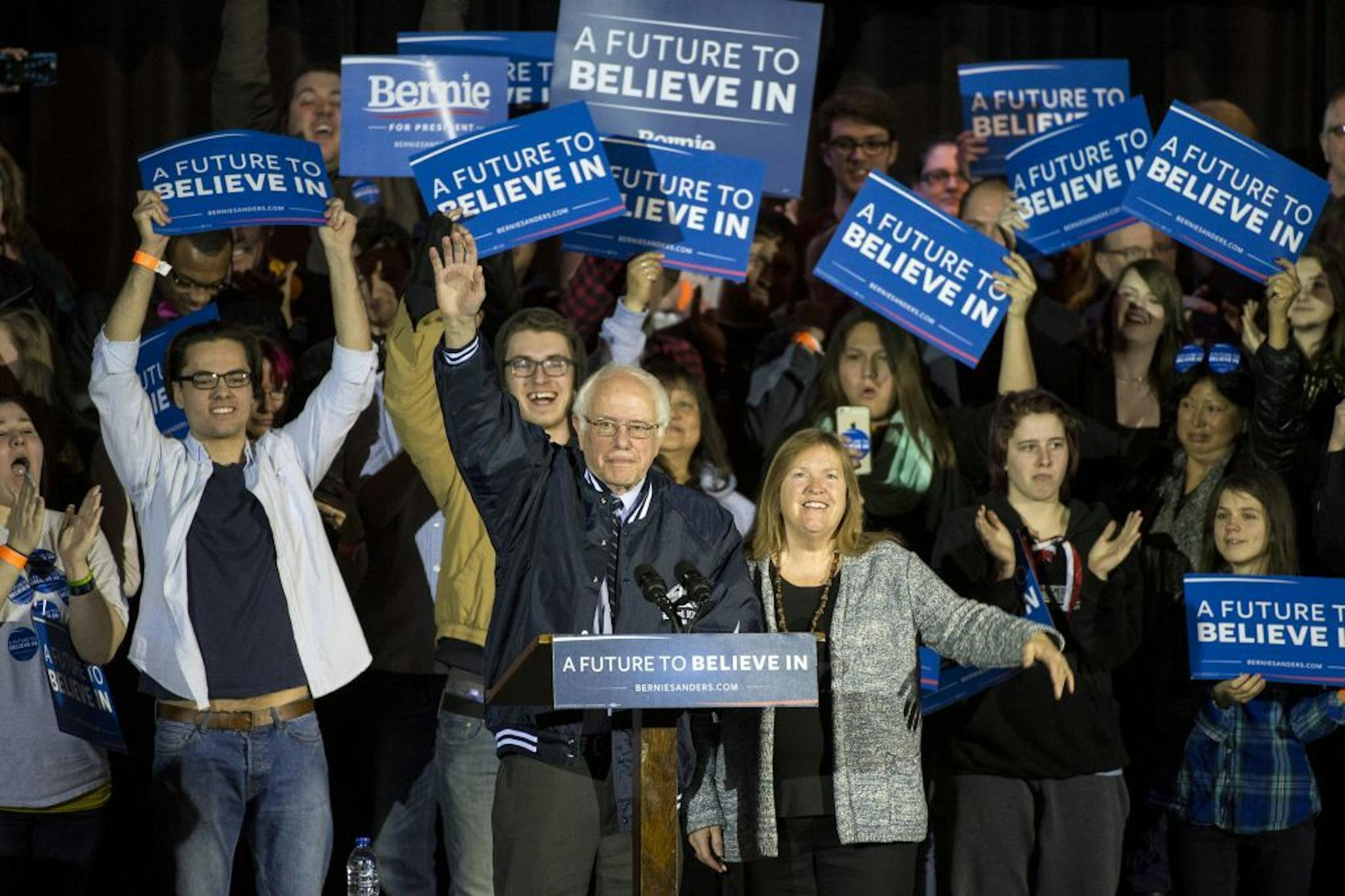 Democratic presidential candidate Bernie Sanders waved at an audience of hundreds at Hibbing High School as he arrived on stage Friday morning.