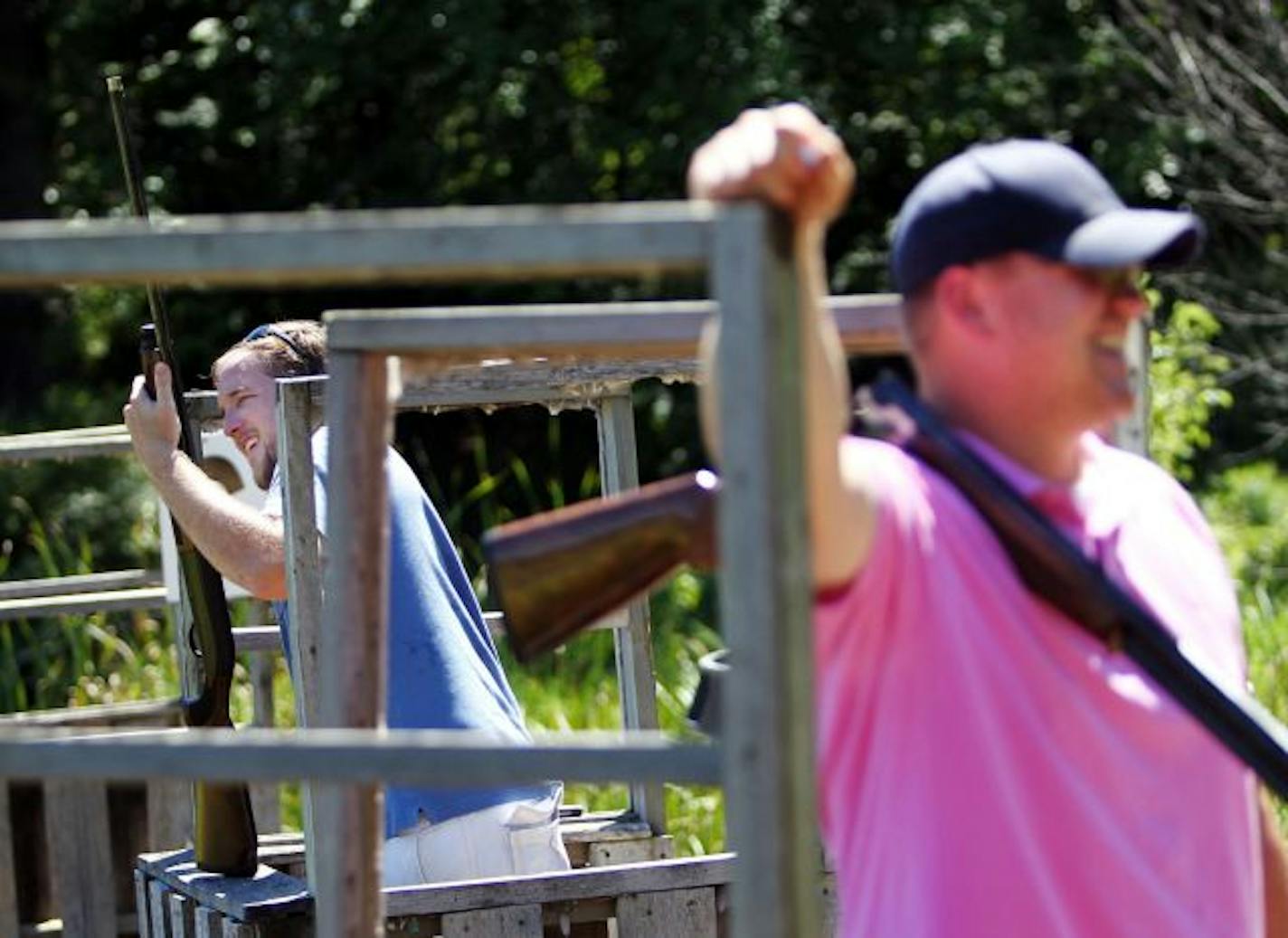 Chad Nelson carried his shotgun between rounds as Adam Reese of Birmingham, Ala., prepared to shoot. The state has seen a decline in hunters in recent years, and officials think a proposed complex could introduce young people to hunting and shooting.